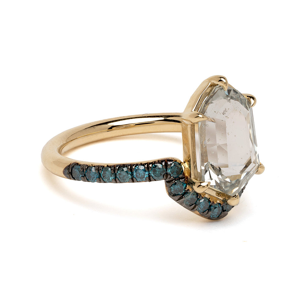 Aura by SK-R120-Sapph-THex-3.25 asymmetrical engagement ring in gold with clear center stone and blue accents