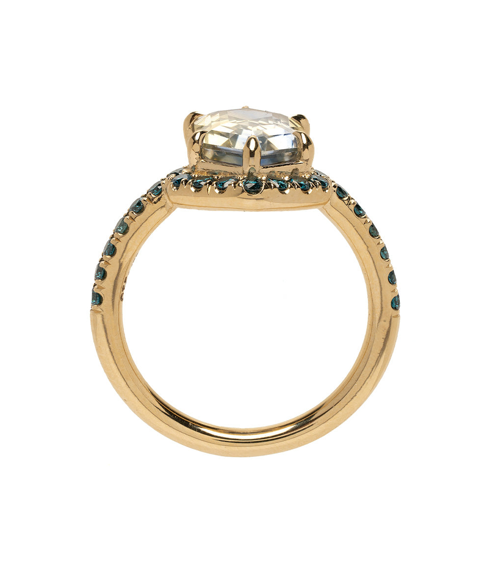 Aura SK-R120-Sapph-Hex-3.25 gold engagement ring with clear center stone and blue gemstone halo