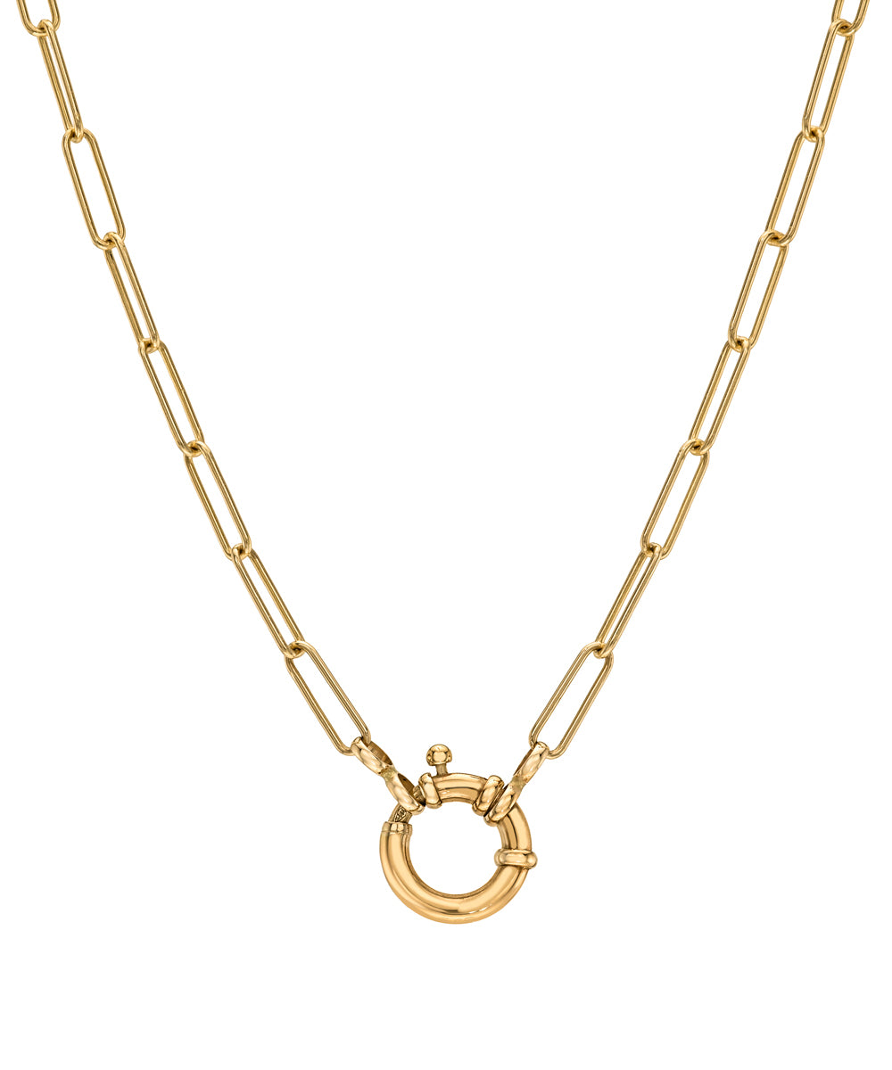 A gold paperclip chain necklace with a small circular ring pendant, shown against a plain white background.