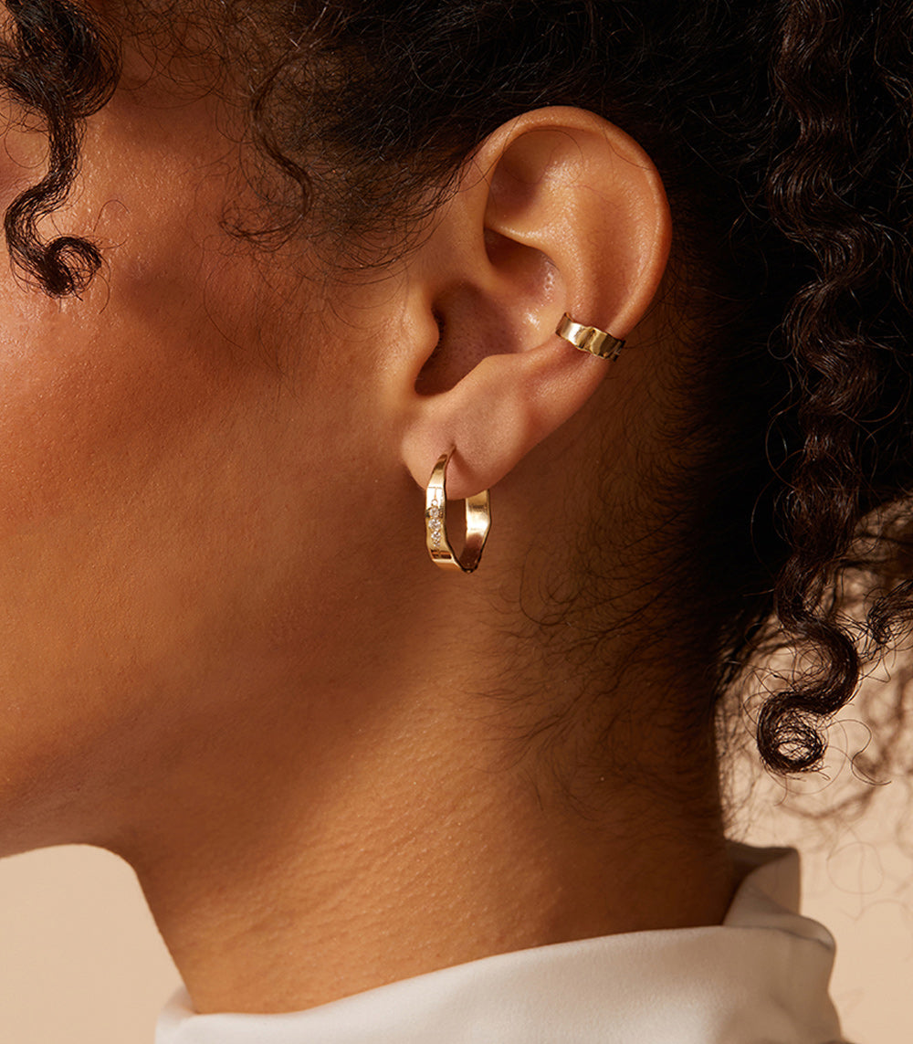 Mini Torn Paper Ear Cuff P-EC1 in shiny 14K yellow gold, sculpted for ear styling.