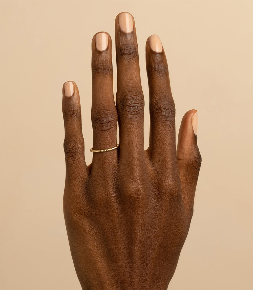 Tiny Coil Band by A-R45 14K yellow gold shiny coil band ring on finger with slim profile