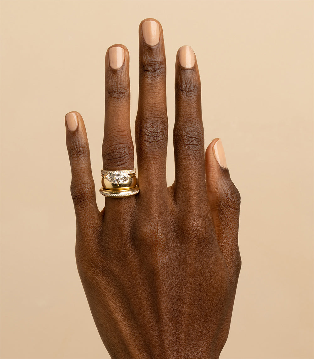 Crescent Band A-R44-EB 14K yellow gold ring with crescent profile on a hand, shiny finish