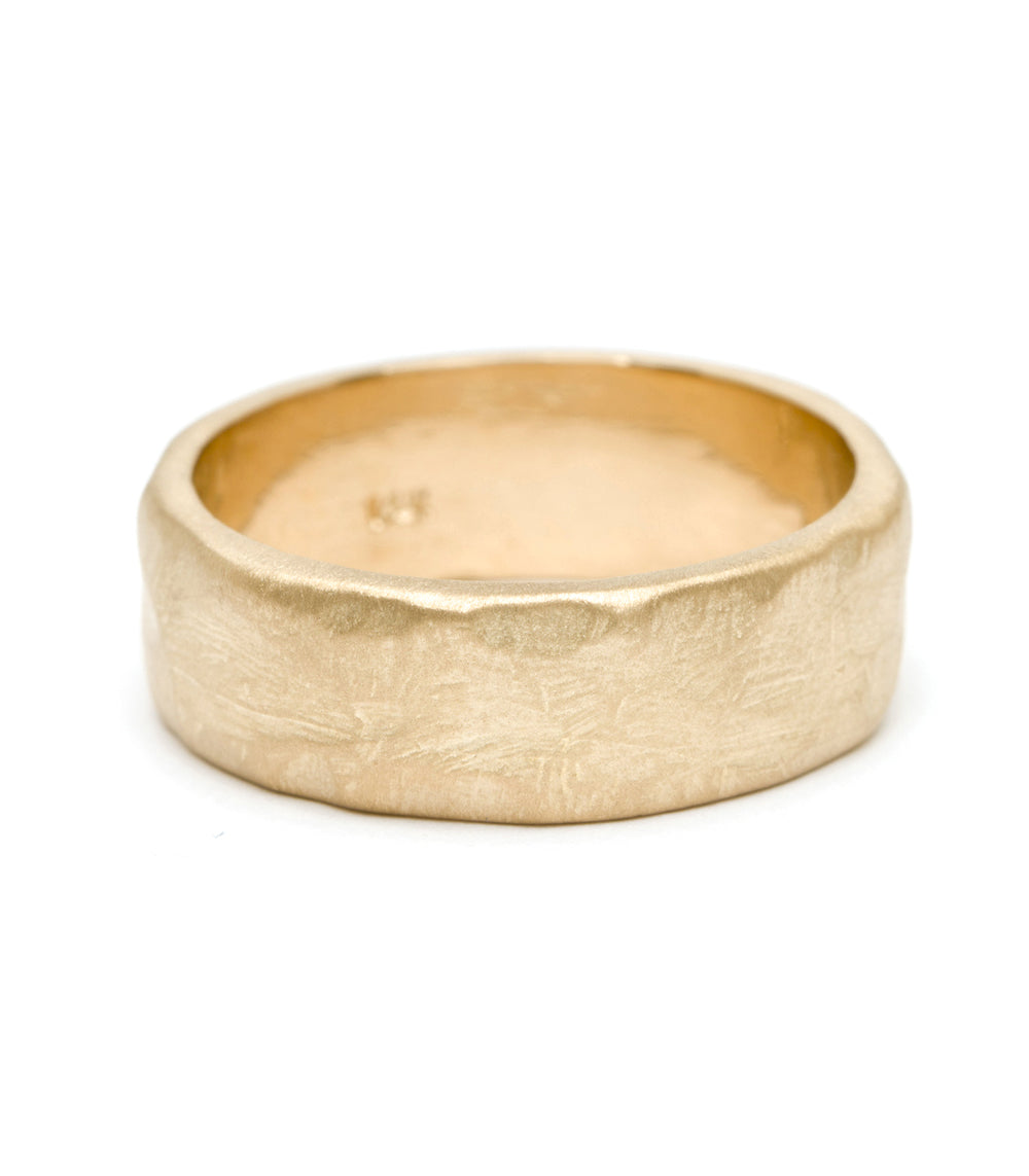 Raw Texture Wedding Band M-R1-7 men's wedding band in 14K yellow gold, matte finish with hammered texture.