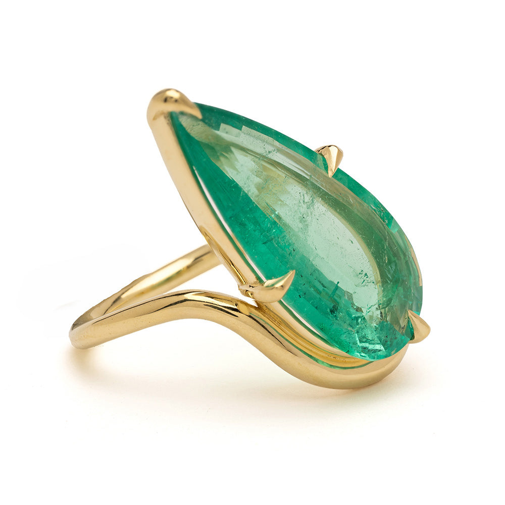 Aura Sofia Kaman ring in green marquise gemstone with gold bezel setting and polished slender band