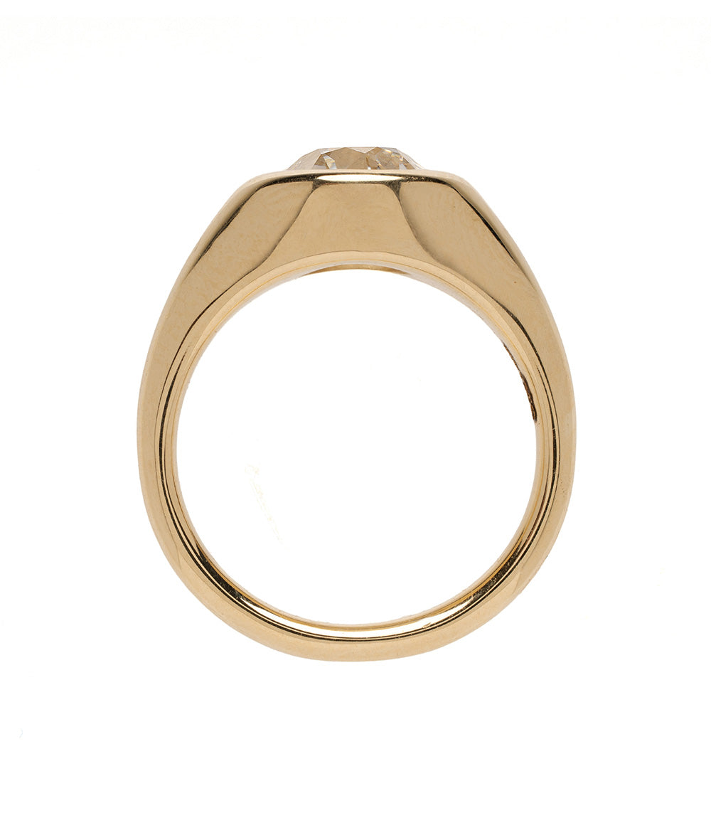 Gold ring with a diamond on a white background
