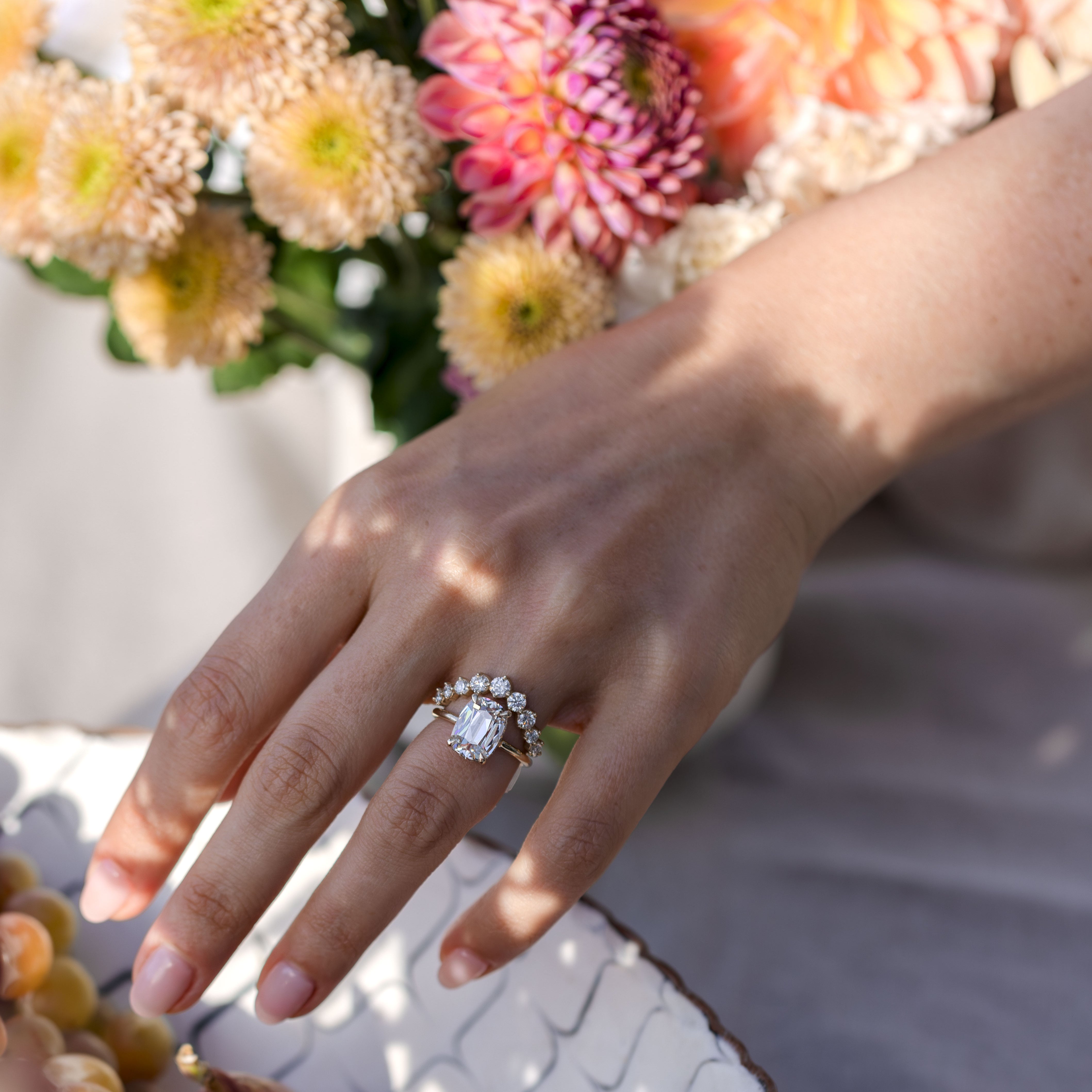 Unique engagement ring and diamond wedding band with flowers