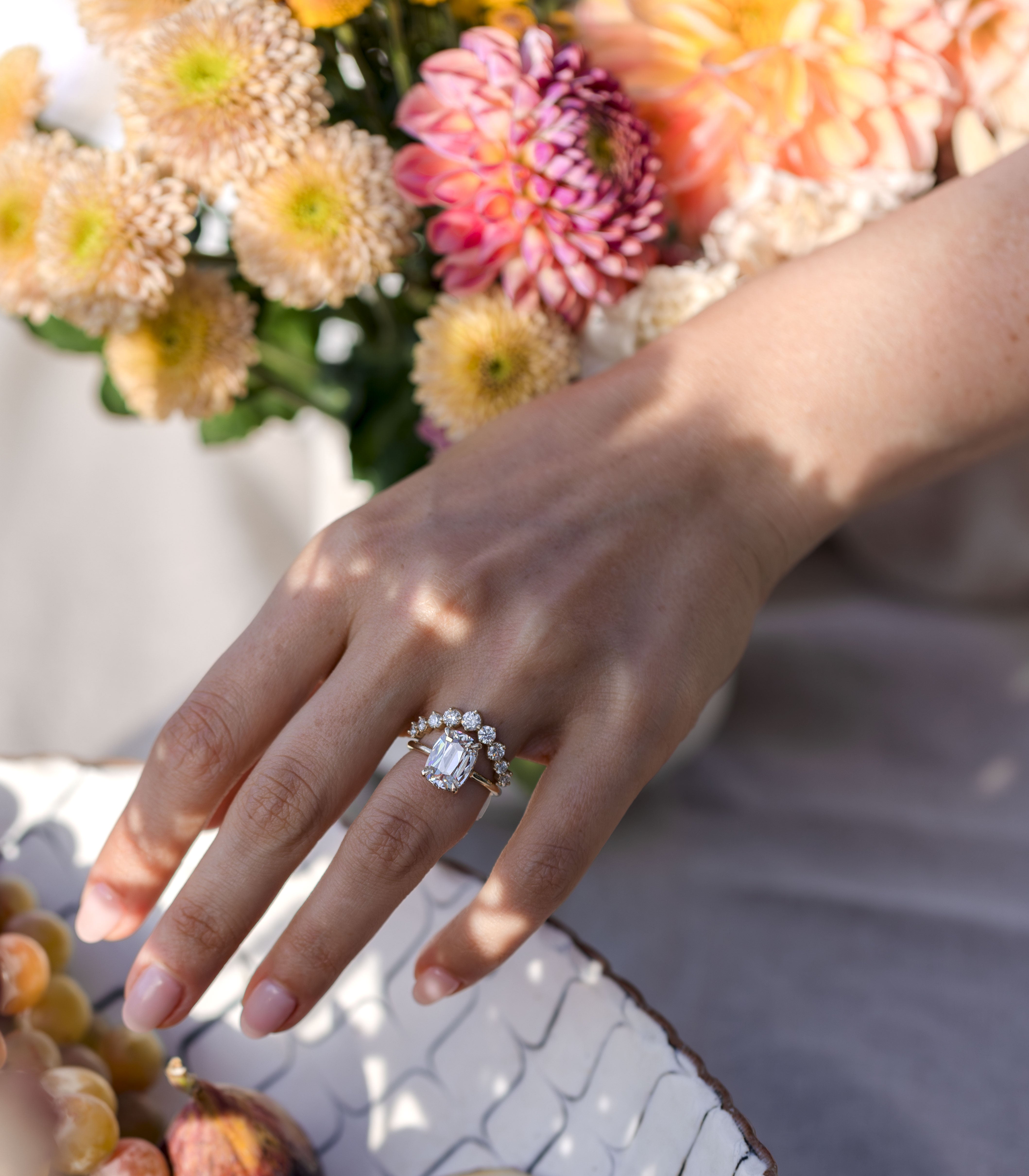 Unique engagement ring and diamond wedding band with flowers