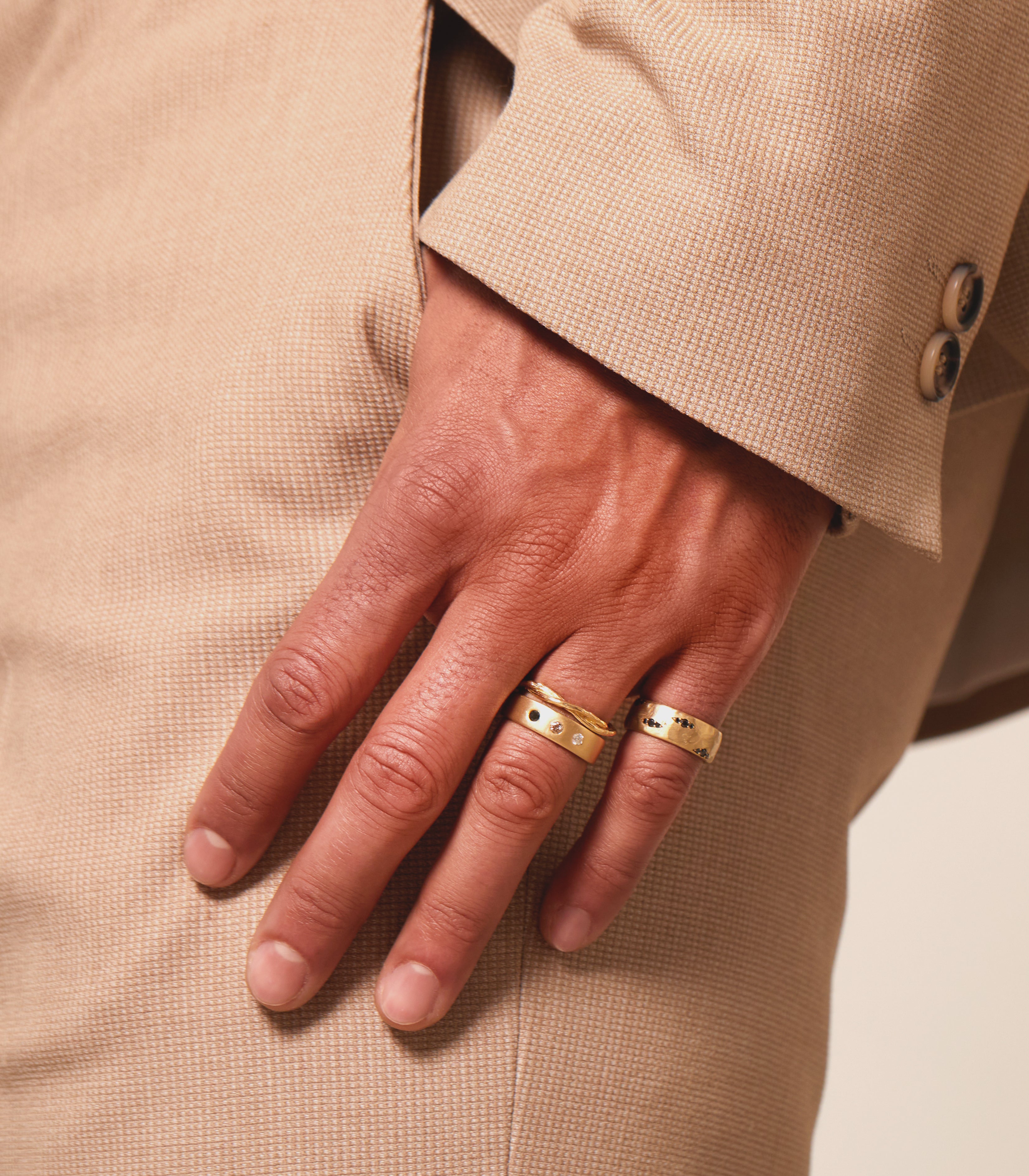 Dusk till Dawn II GN-R5 bands in shiny gold on hand, two slim rings with small clear stones