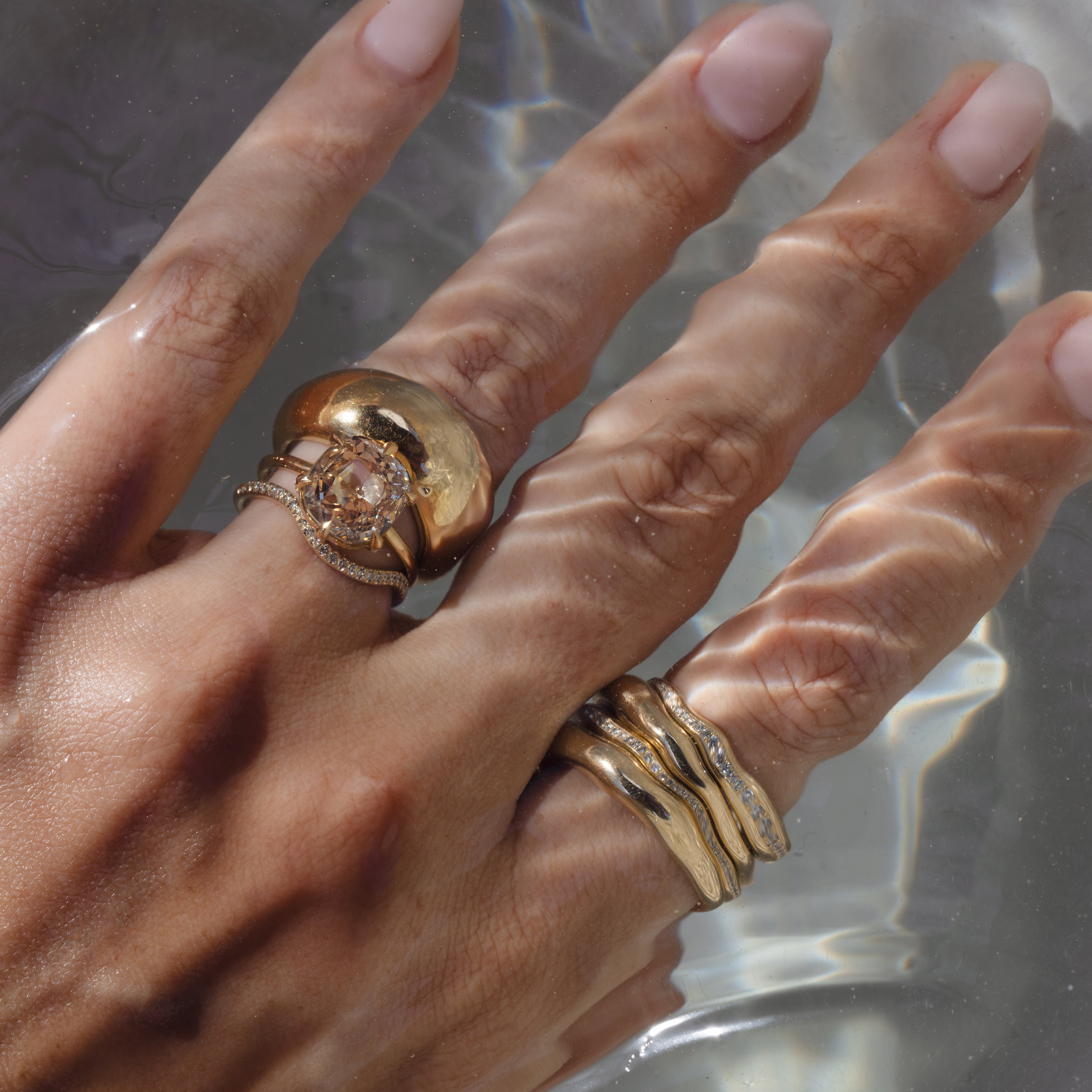 Ella SK-R62-ND-CU-CD-4.62 unique engagement ring, gold band with round diamond halo on fingers in water light