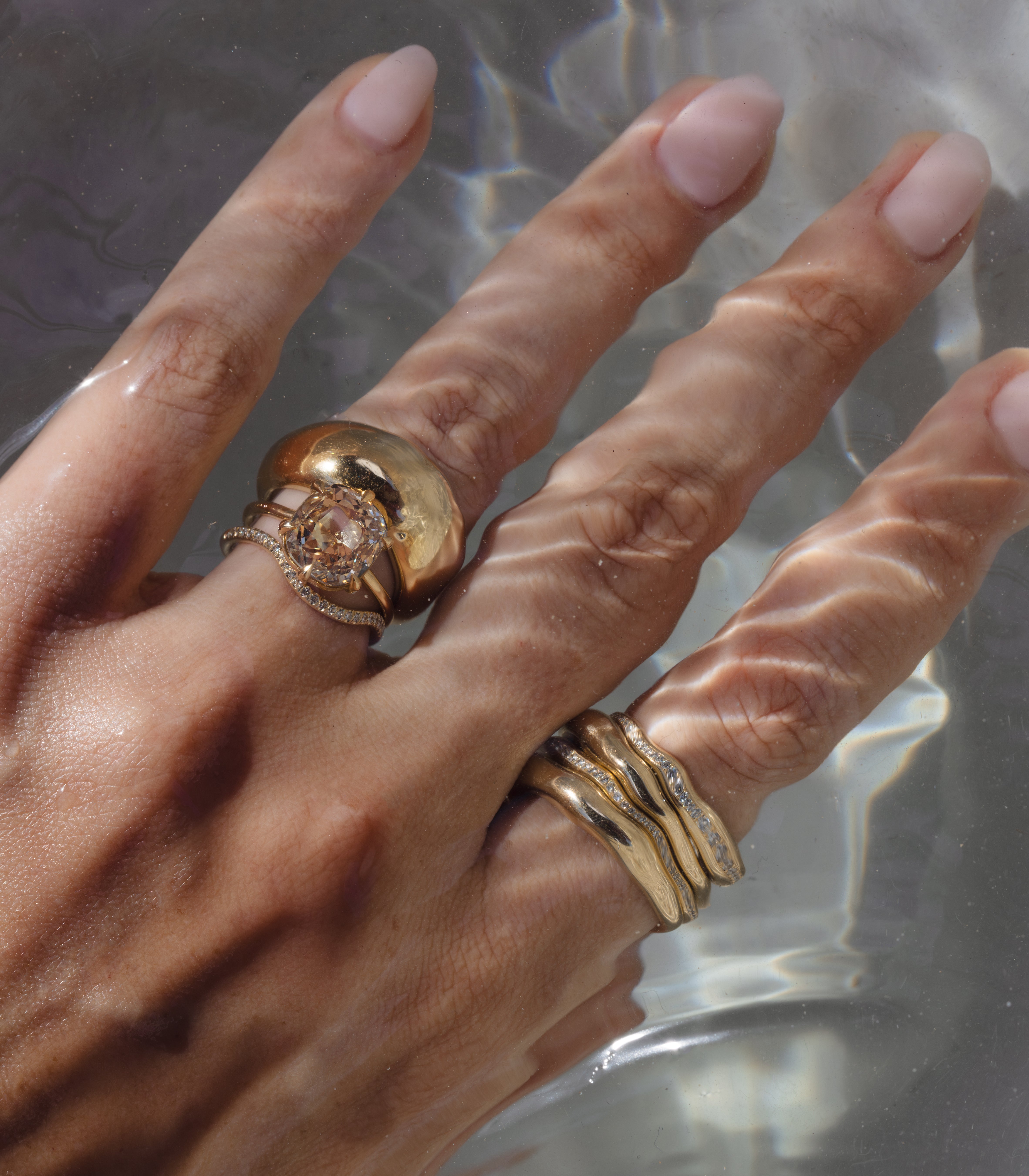 Ella SK-R62-ND-CU-CD-4.62 unique engagement ring, gold band with round diamond halo on fingers in water light
