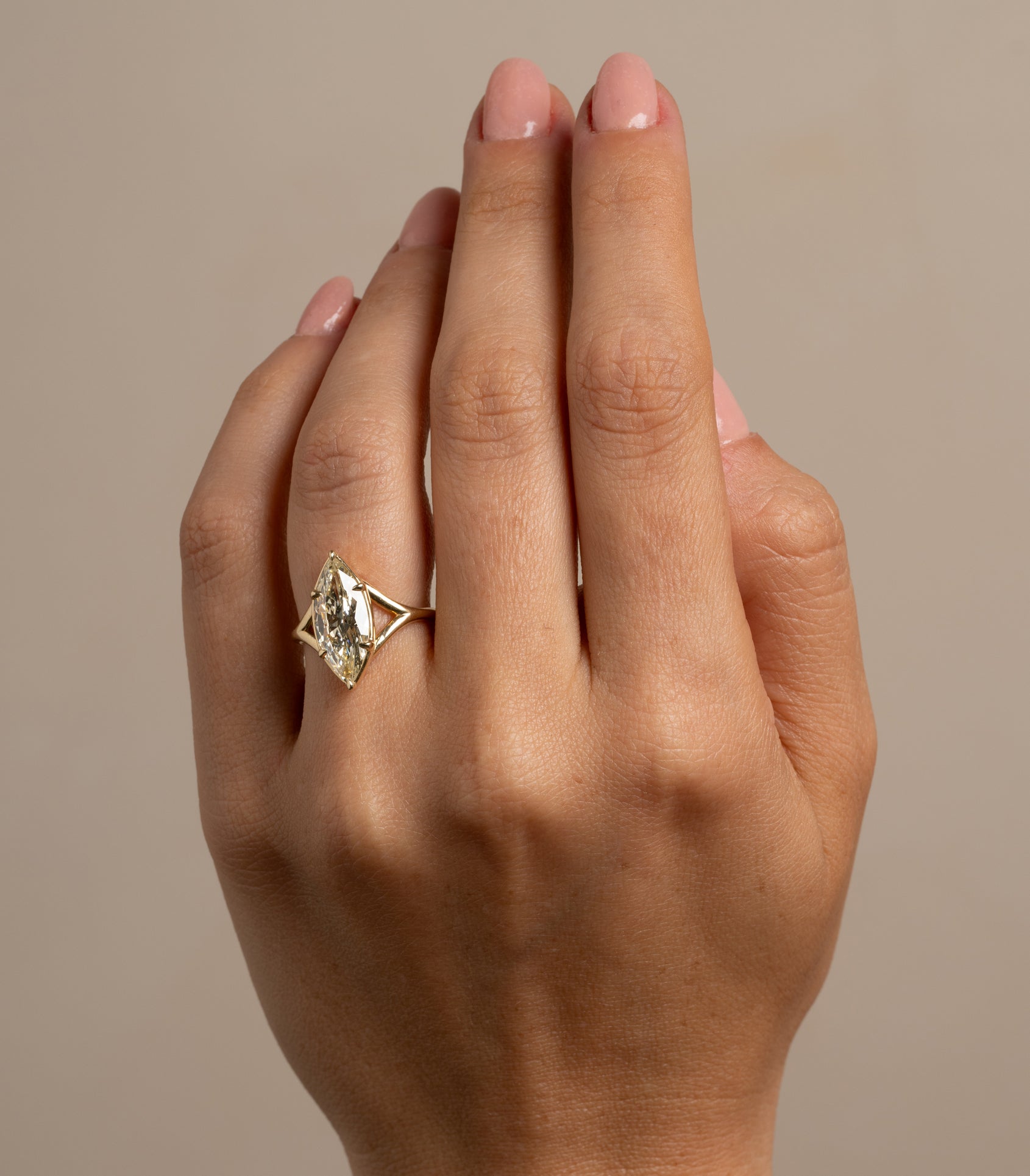 Marlow SK-R109-ND-MB-CD-2.58 unique engagement ring in gold, highlighted by a central diamond.