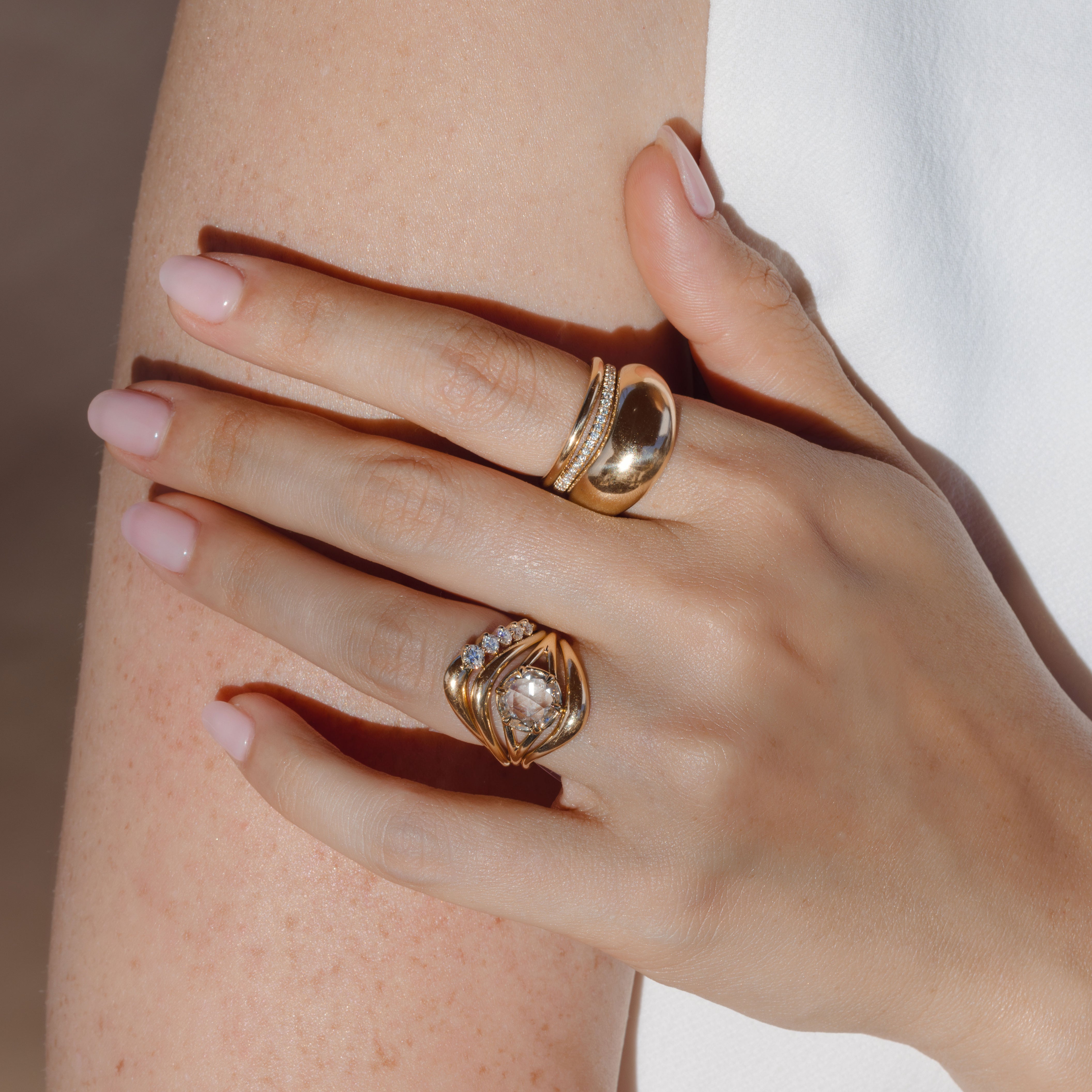 Marlow by SK-R109-ND-RRC-CD-2.02 gold engagement ring stack with diamond pavé highlights on a hand