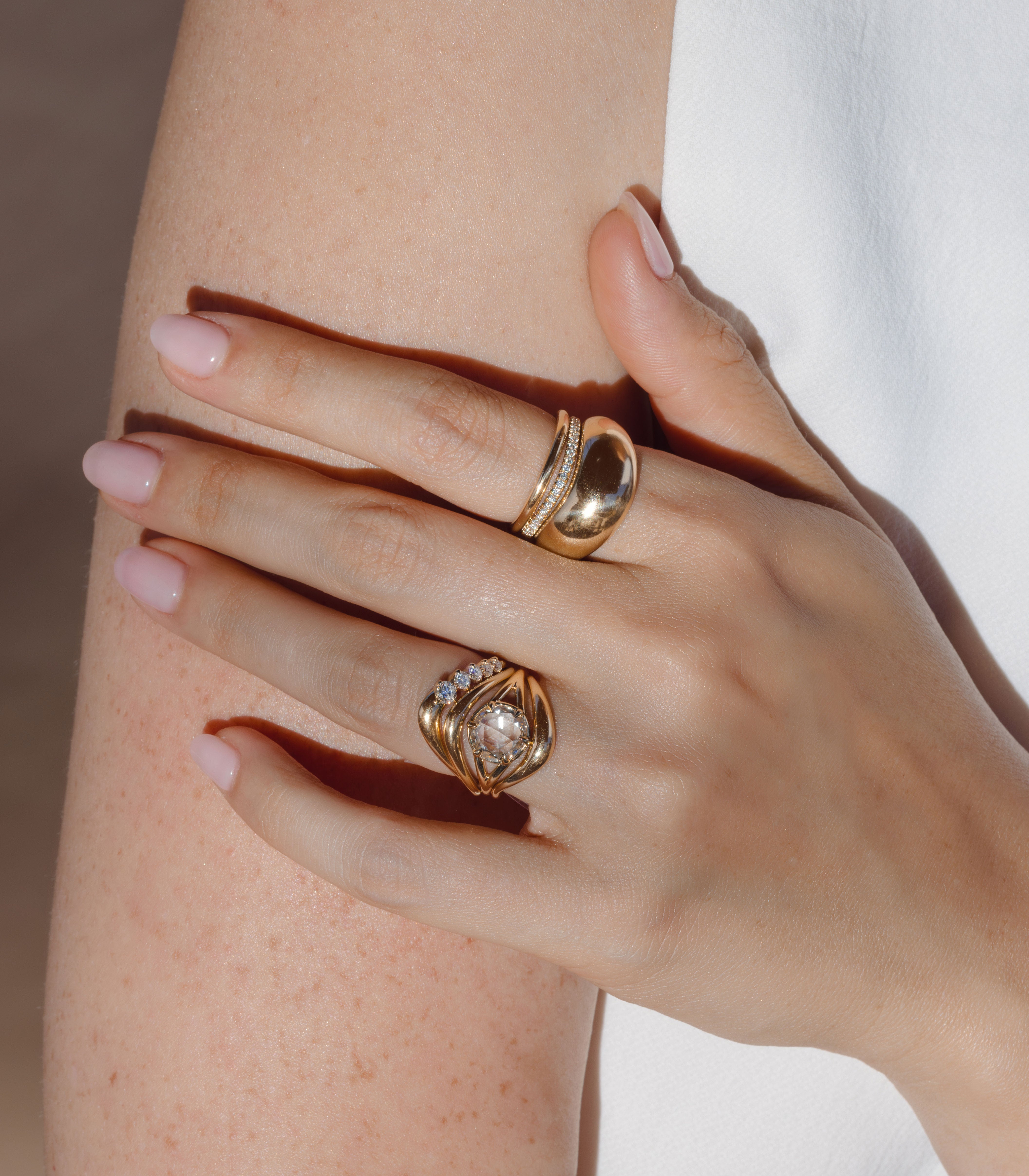 Marlow by SK-R109-ND-RRC-CD-2.02 gold engagement ring stack with diamond pavé highlights on a hand