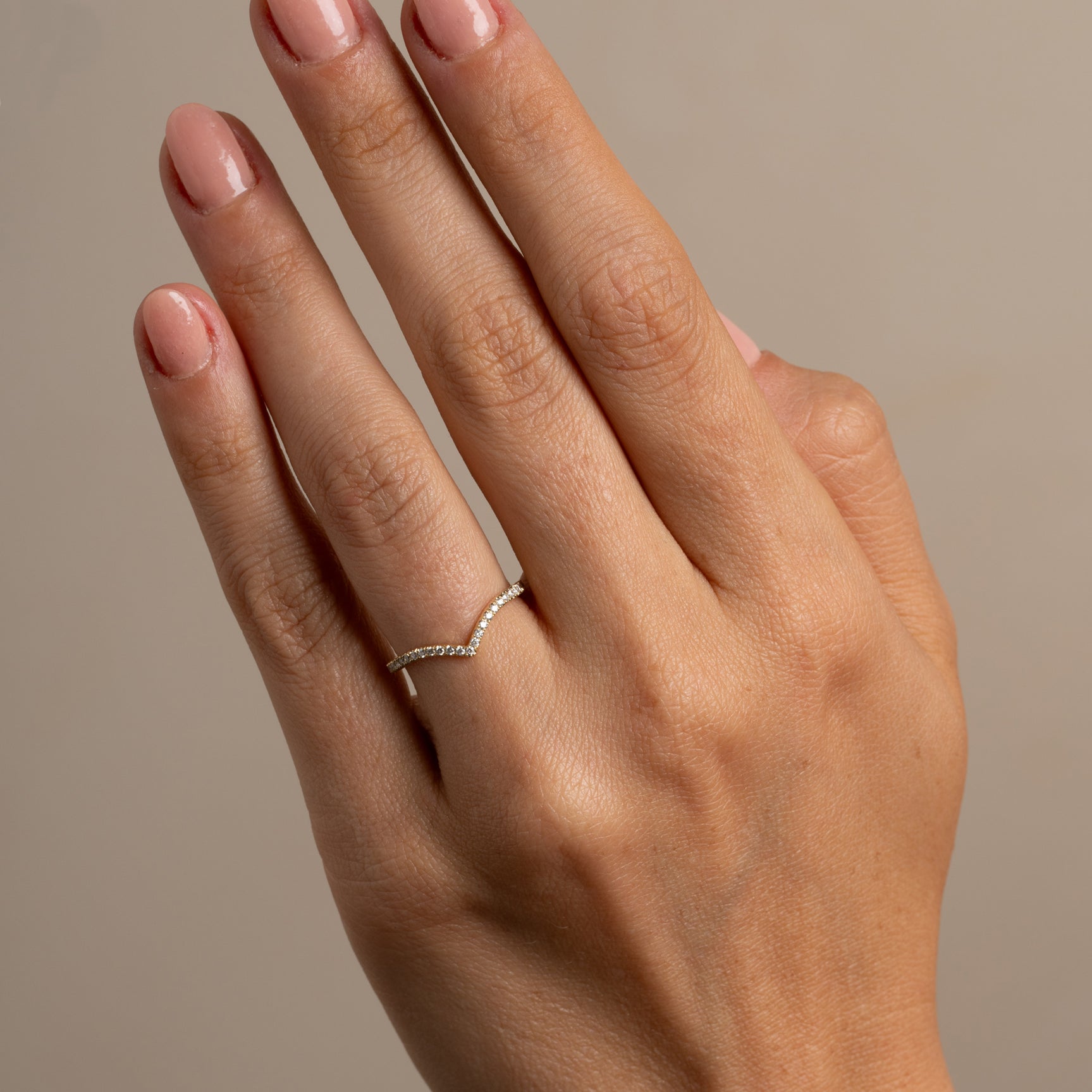 Mini Chevron Band by A-R1-P, 14K yellow gold chevron band on fingers in soft studio light