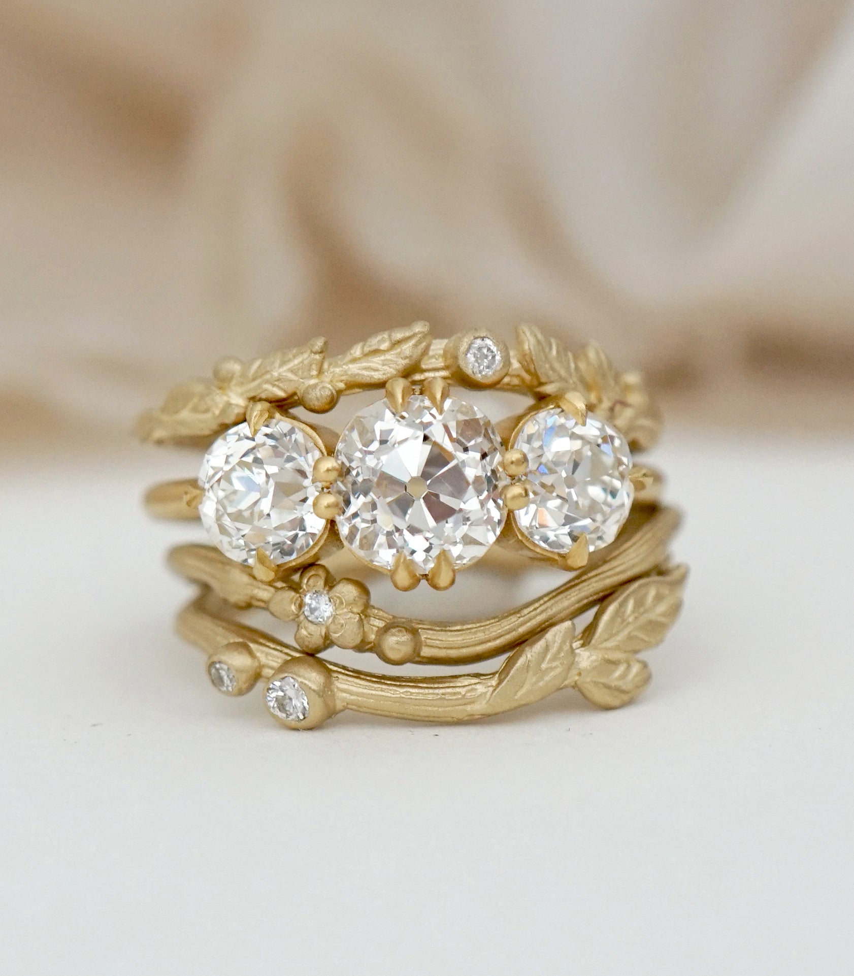 Unique engagement ring in gold with boho engagement rings style, asymmetrical 3 stone engagement ring