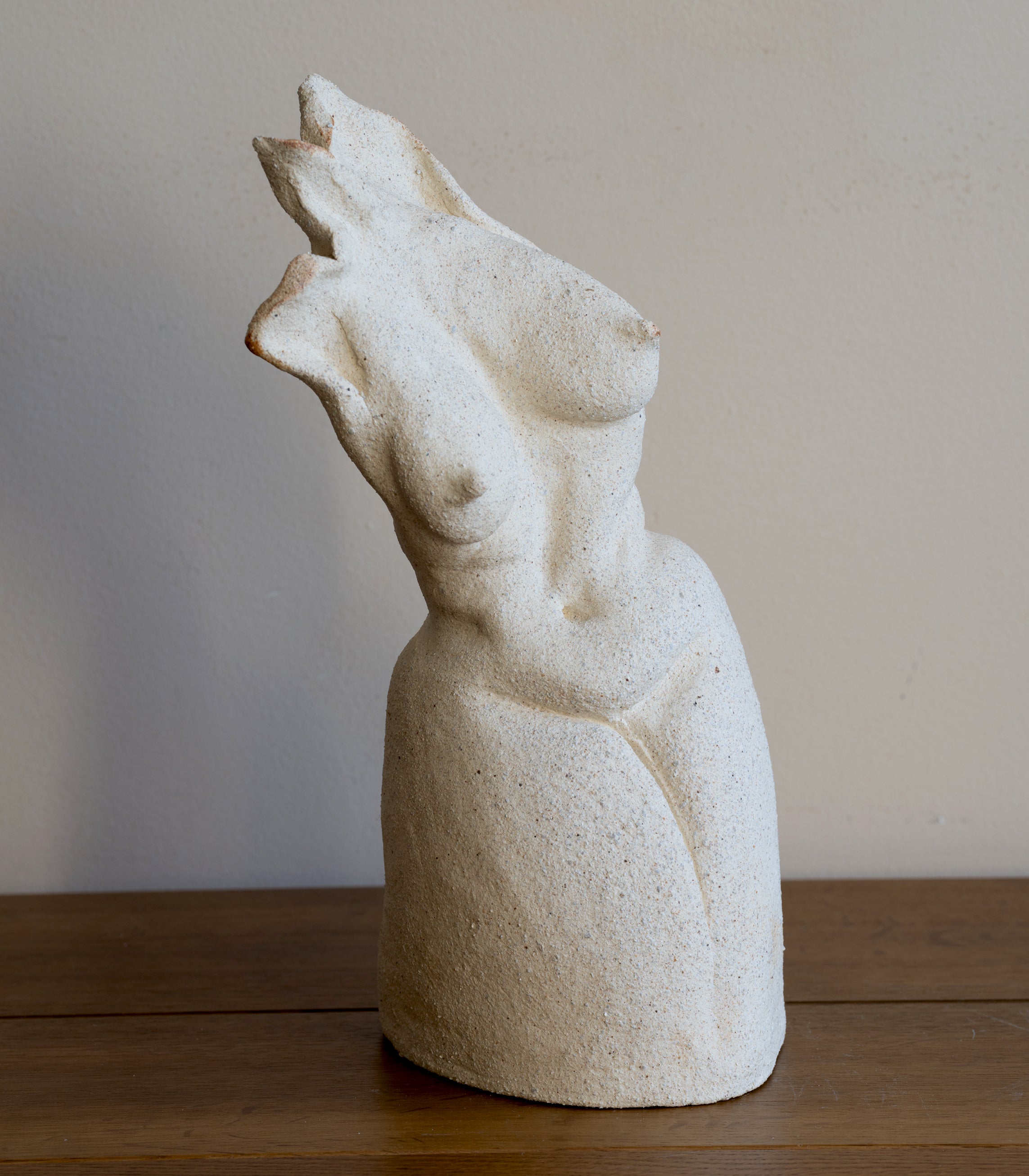 Standing Sculpture I by RM-001, light stone standing figure with smooth carved face on display