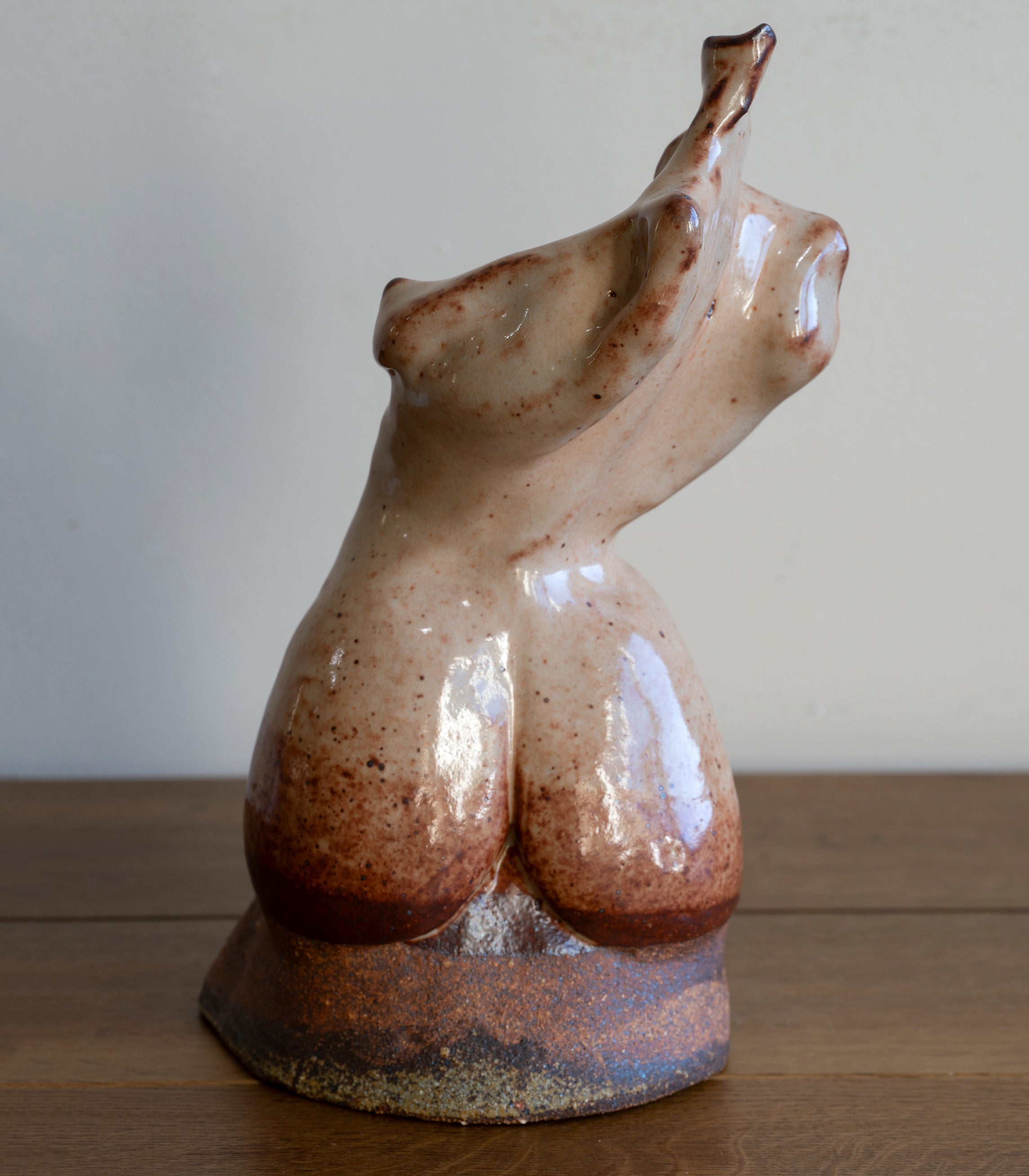 Glazed Sculpture I by RM-004, glazed ceramic figurine with warm speckled brown finish on light background