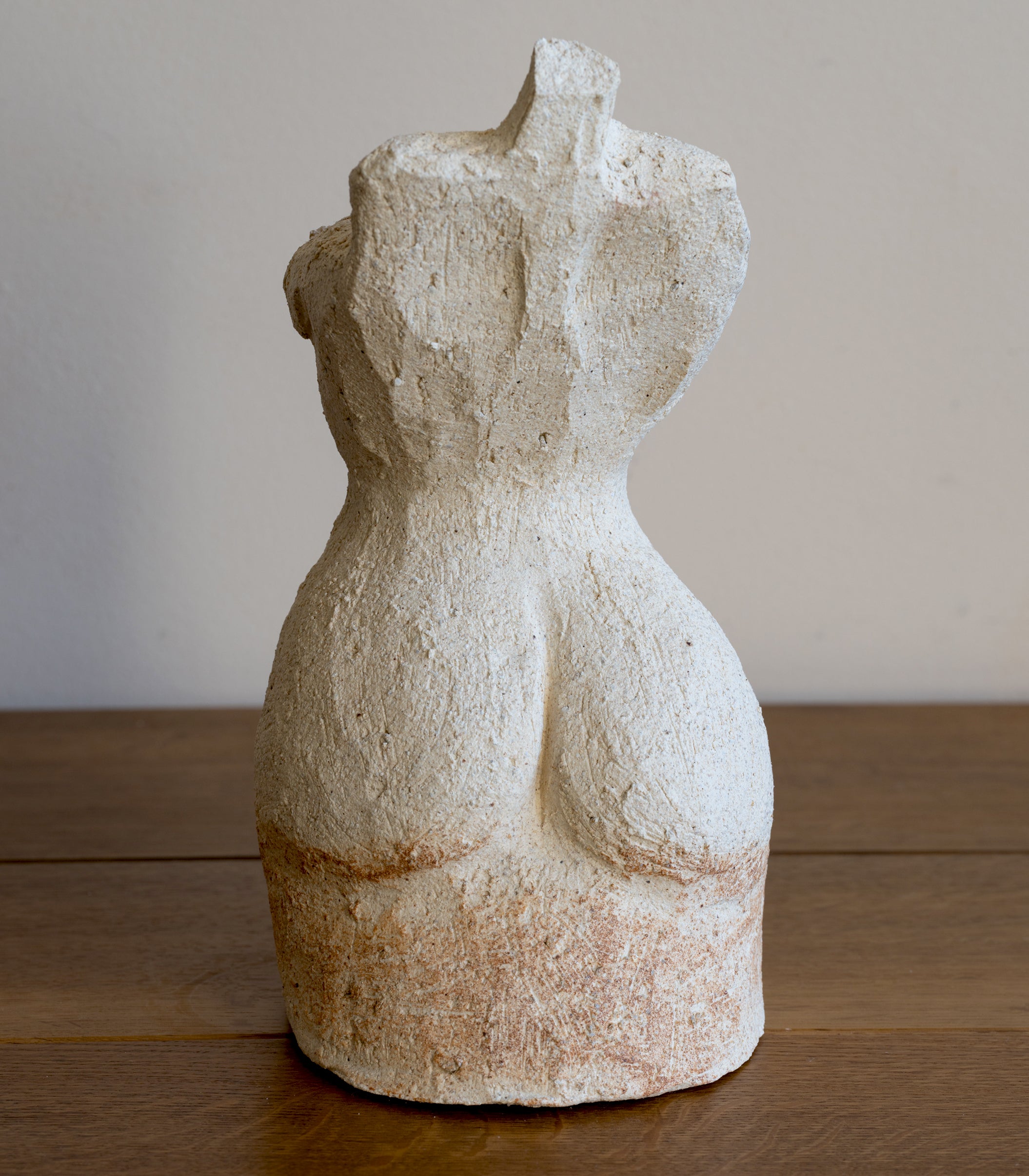 Standing Sculpture III by RM-007 standing sculpture in speckled off-white stone with smooth curved form