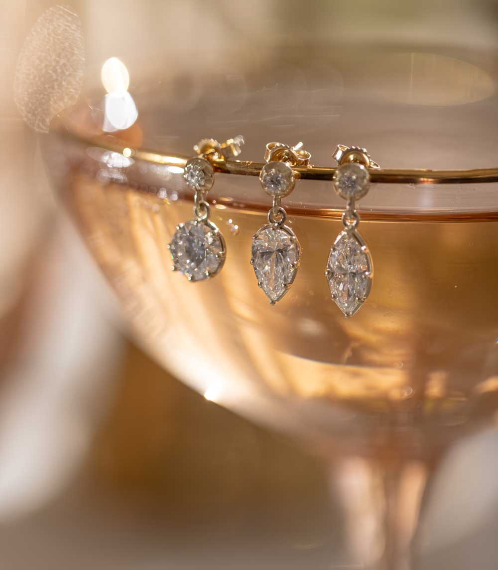 Gigi Earrings SK-E117-LGD-MB-1.00 gold earrings with three teardrop stones, warm glow
