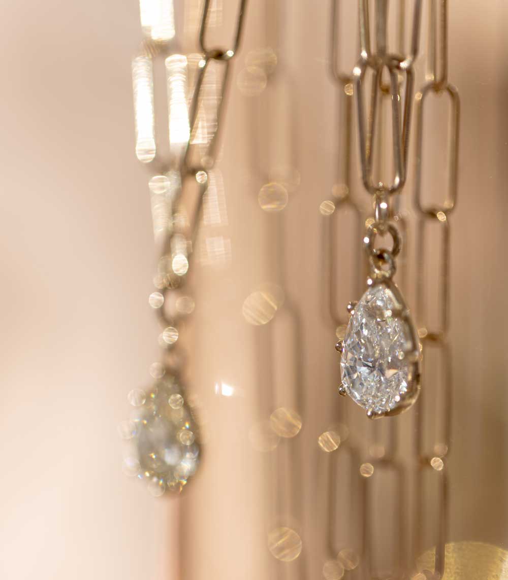 Layering Gigi Necklace by Sofia Kaman in warm gold with teardrop diamond pendant, layered sparkle.