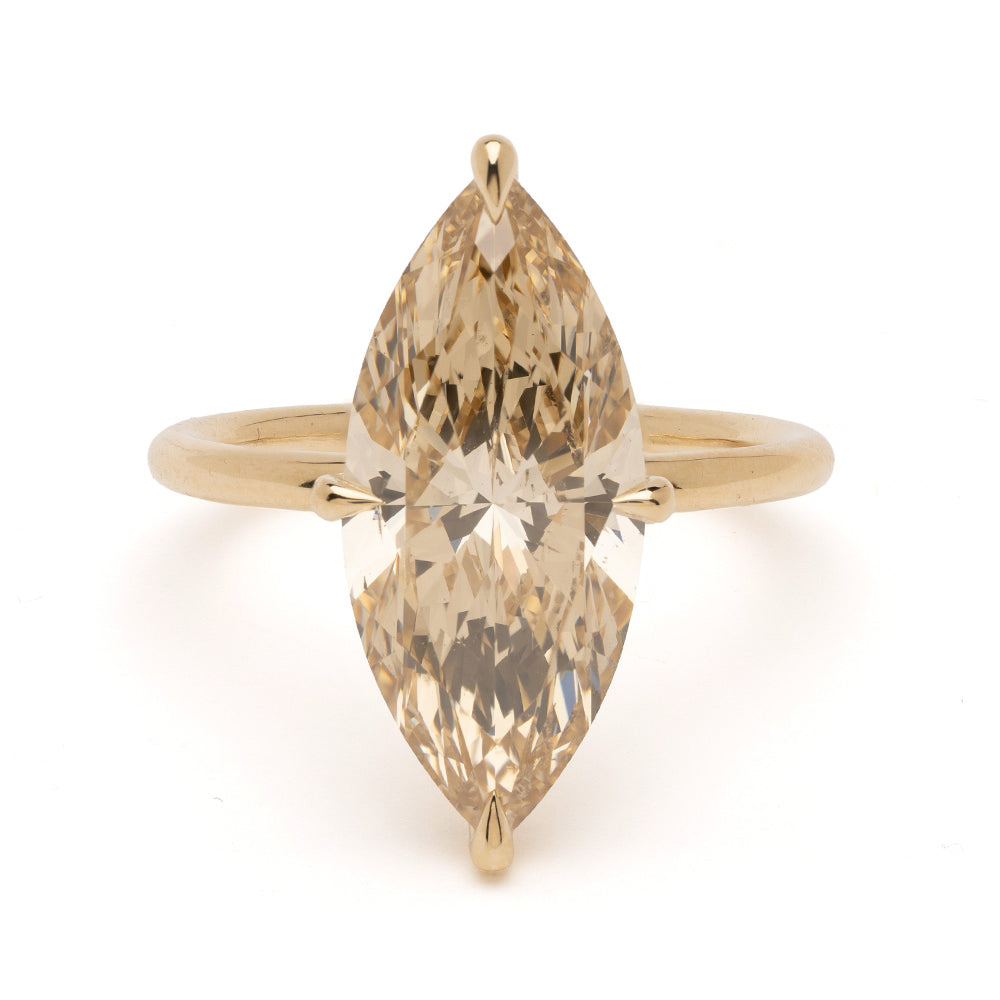 Billie Sofia Kaman engagement ring in yellow gold with marquise cut diamond sparkle facets