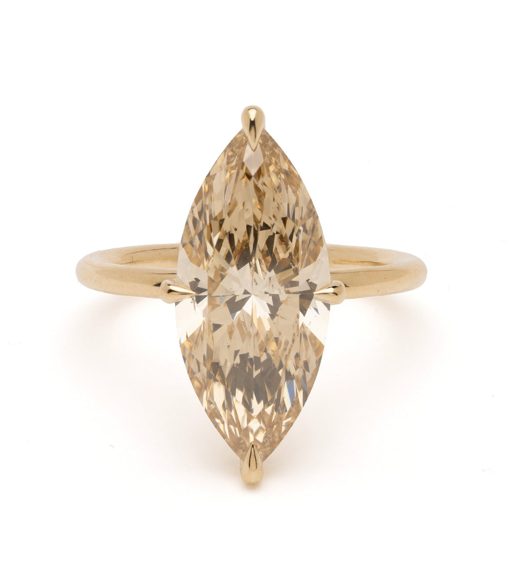 Billie Sofia Kaman engagement ring in yellow gold with marquise cut diamond sparkle facets