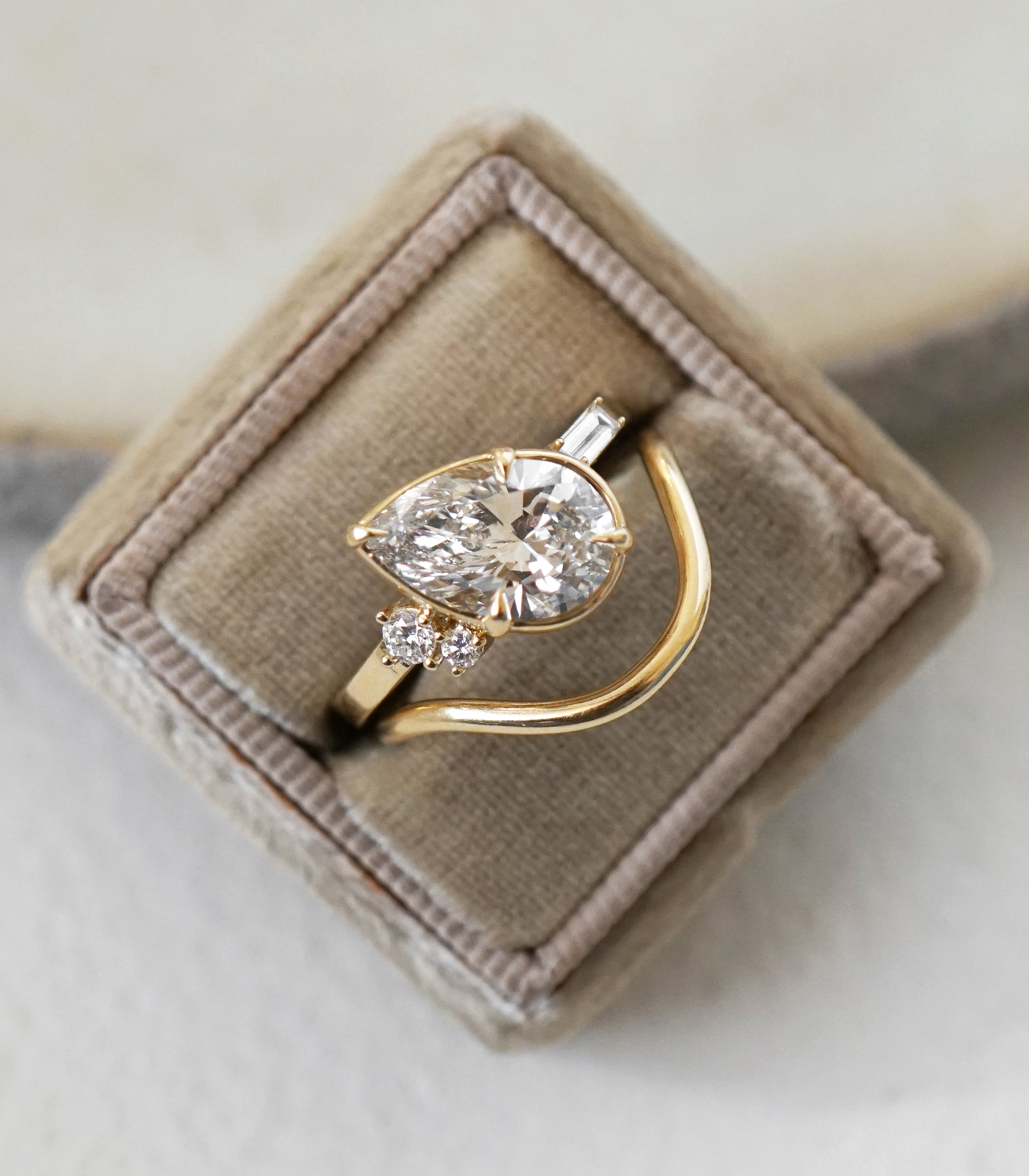 Sydney SK-R96-LGD-PS-WD-2.85 understated engagement ring in gold with asymmetrical engagement ring setting.