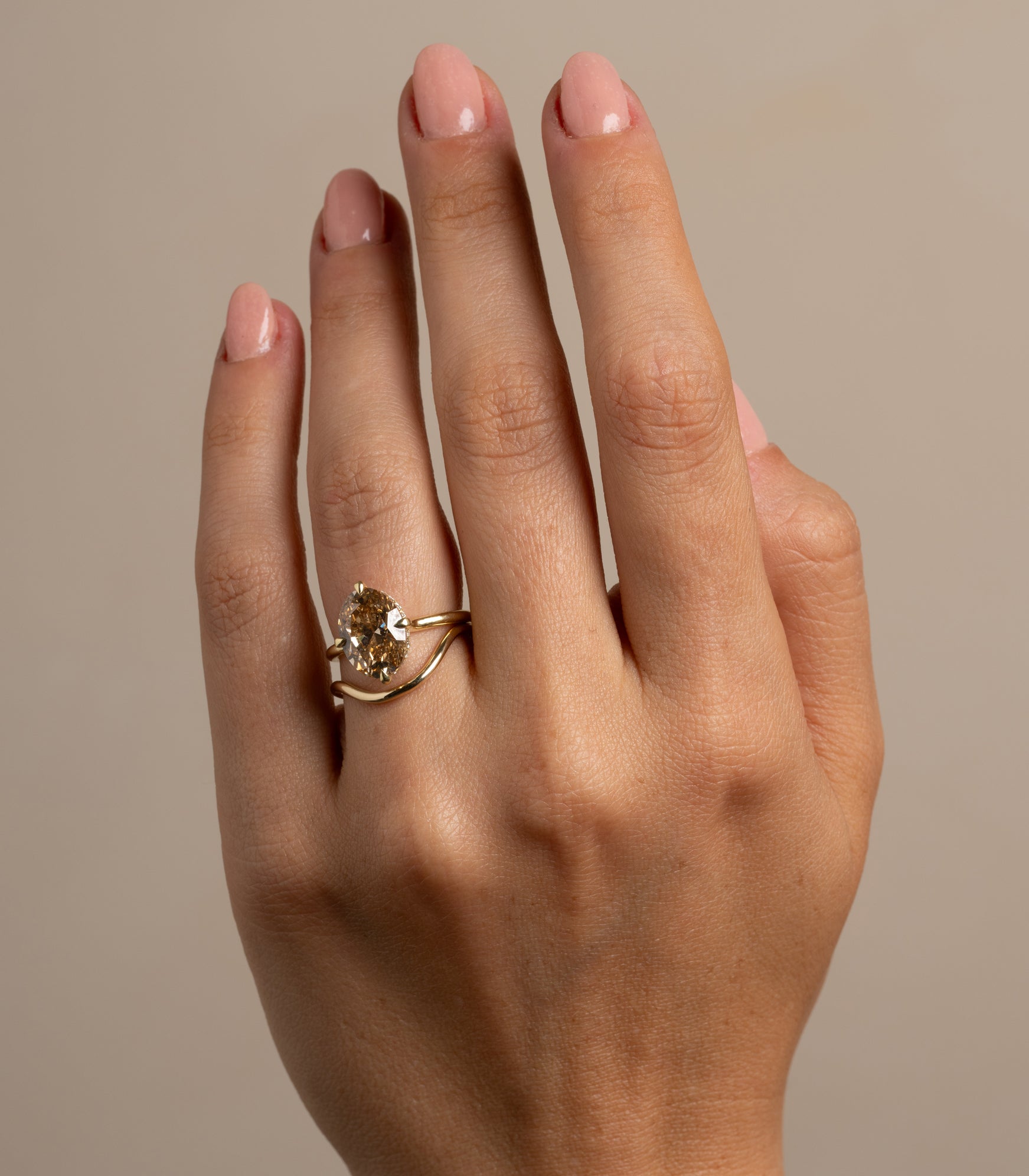 Beau Band by A-R41 matte 14K yellow gold engagement ring band with softly reflective stones on hand
