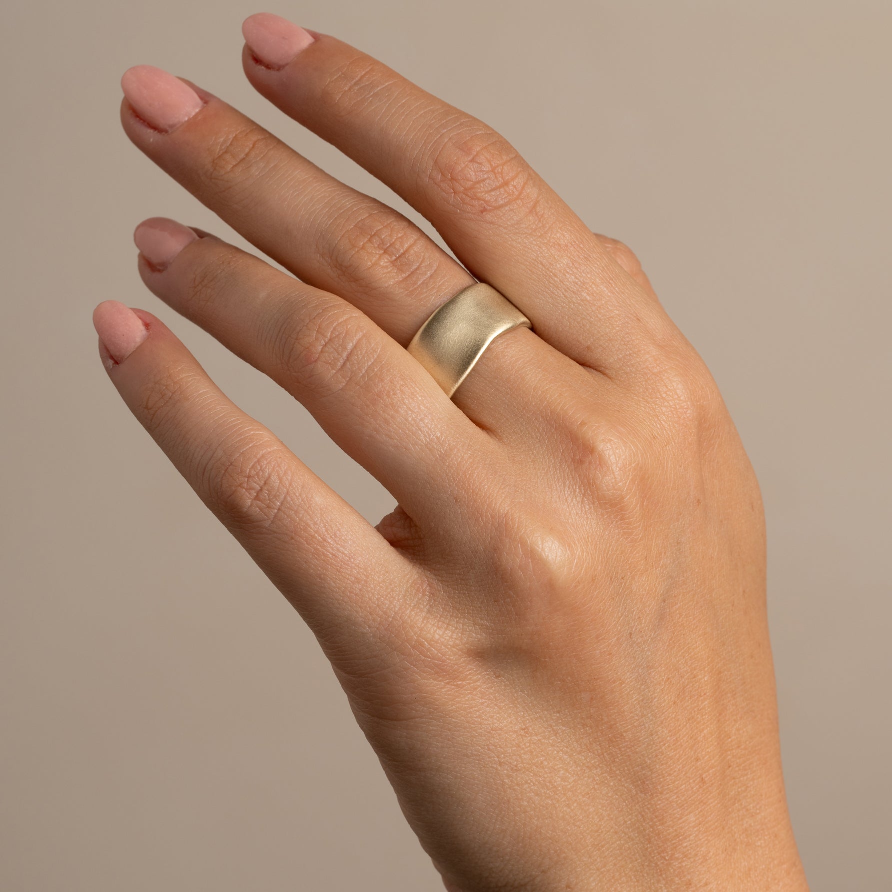 Torn Paper Band by P-R4 band in shiny 14K yellow gold with smooth rounded torn-paper profile