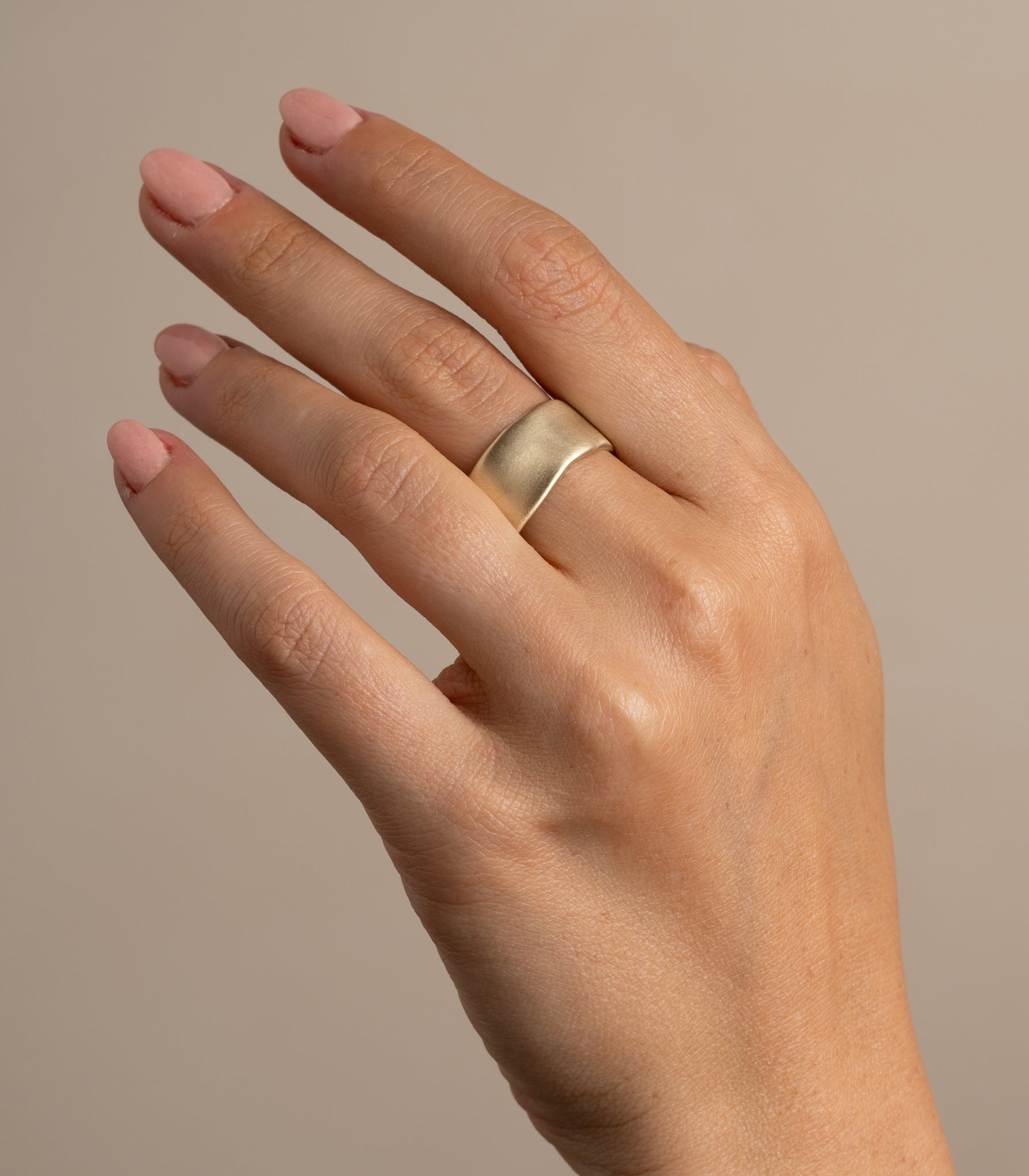 Torn Paper Band by P-R4 band in shiny 14K yellow gold with smooth rounded torn-paper profile