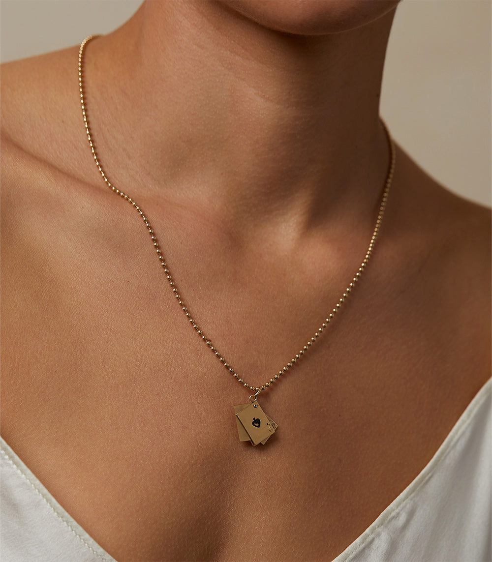 Bet On You Charm by VC-P20 gold charm pendant necklace on fine chain with small square tag