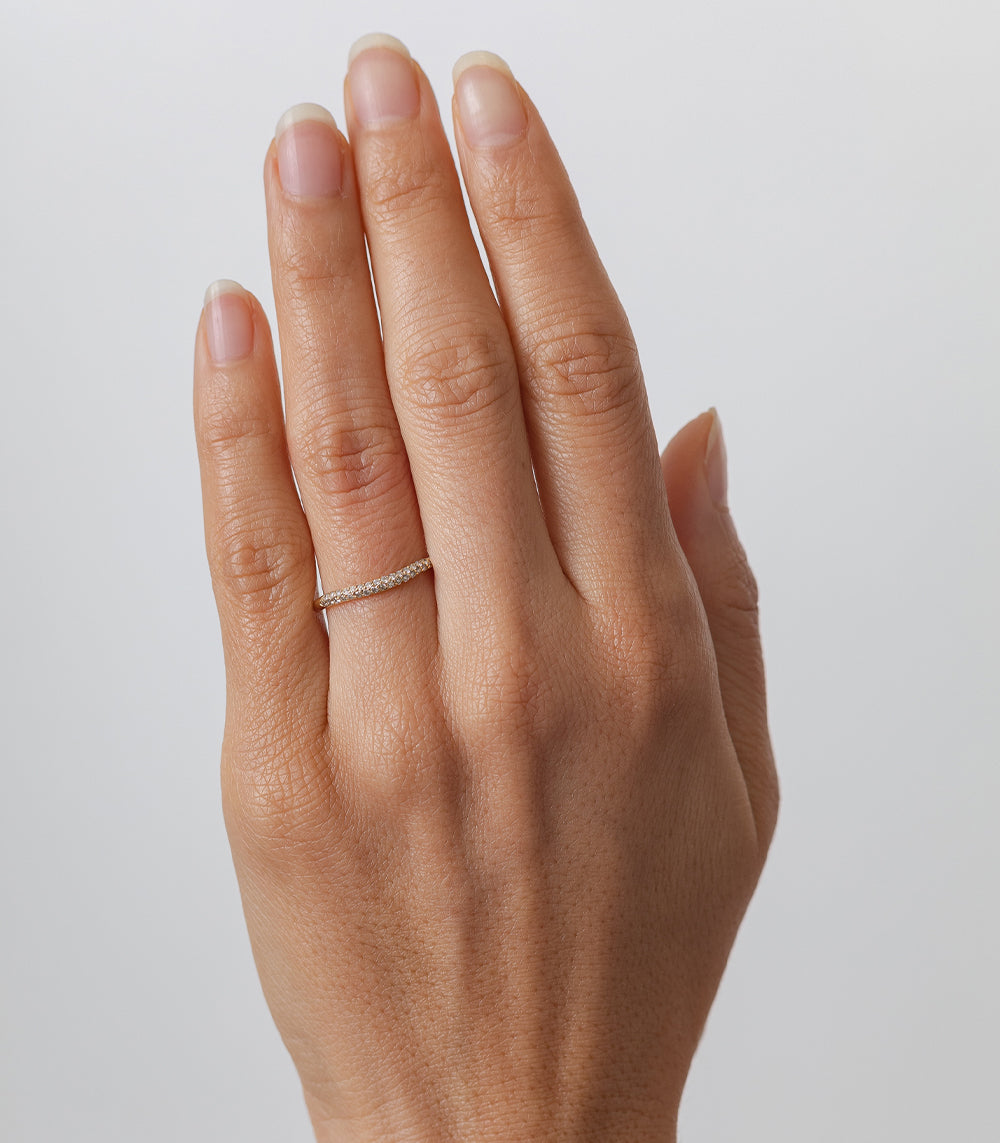 Petite Wavy Band by T-R44, 14K white gold wavy ring with shiny finish, on finger