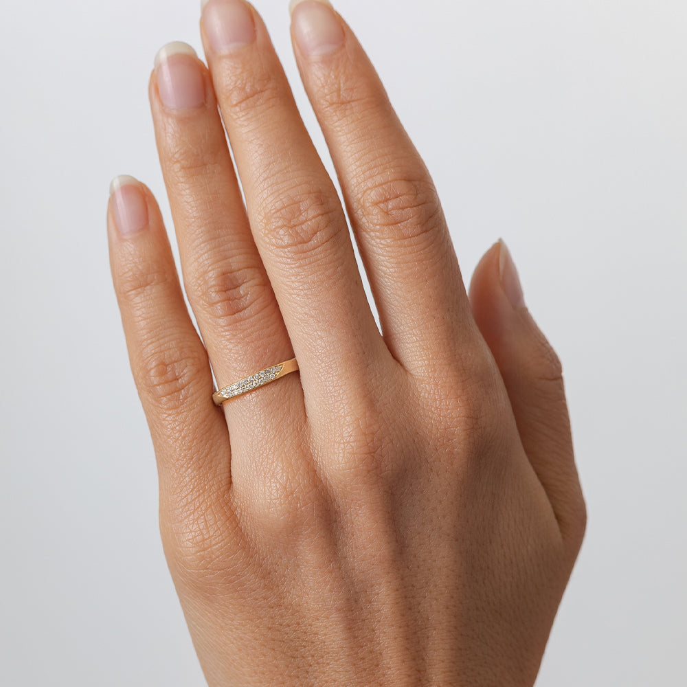 Torn Paper Band P-R1-Spot ring 14K yellow gold shiny torn-paper style band on fingertip