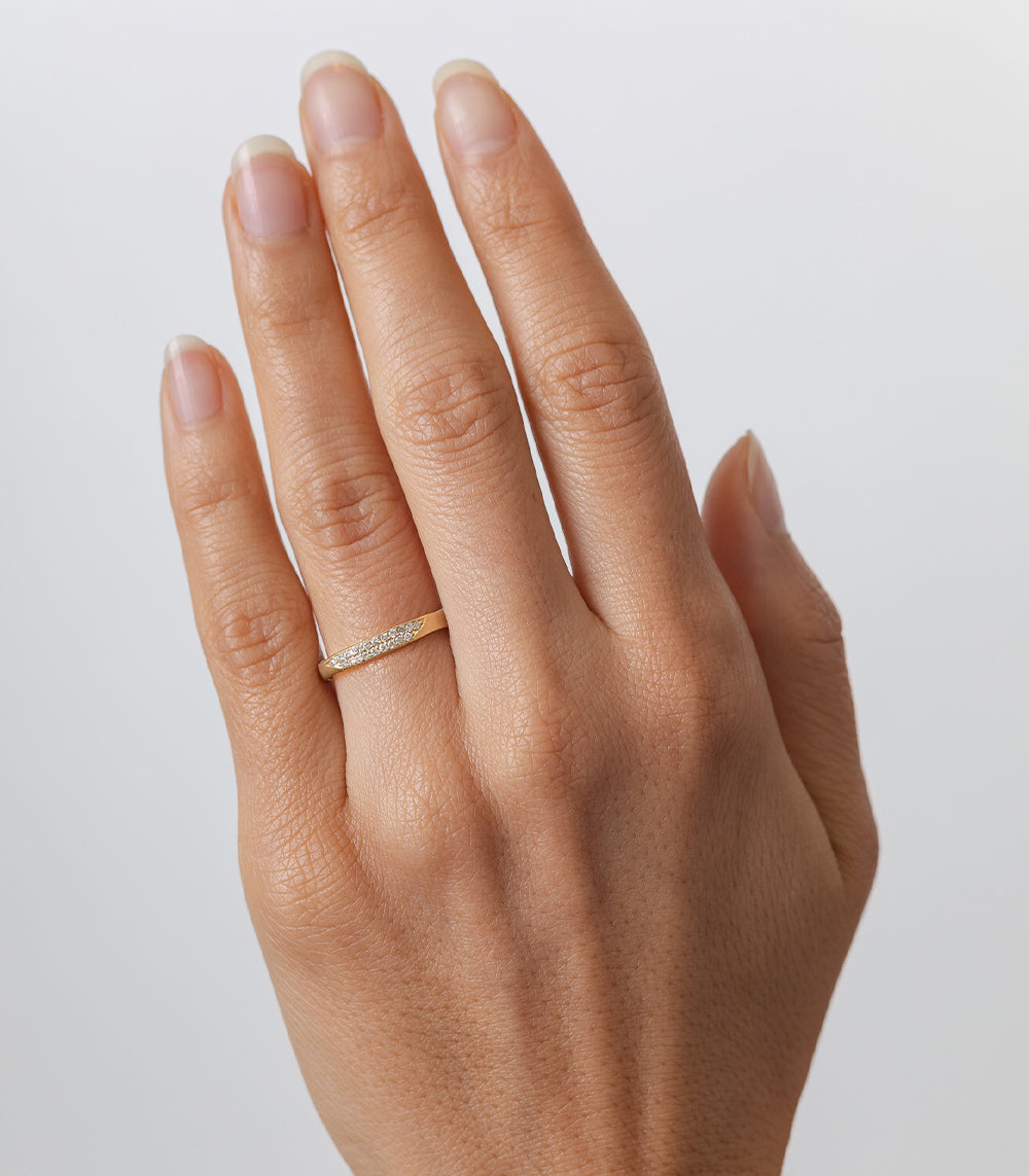 Torn Paper Band P-R1-Spot ring 14K yellow gold shiny torn-paper style band on fingertip