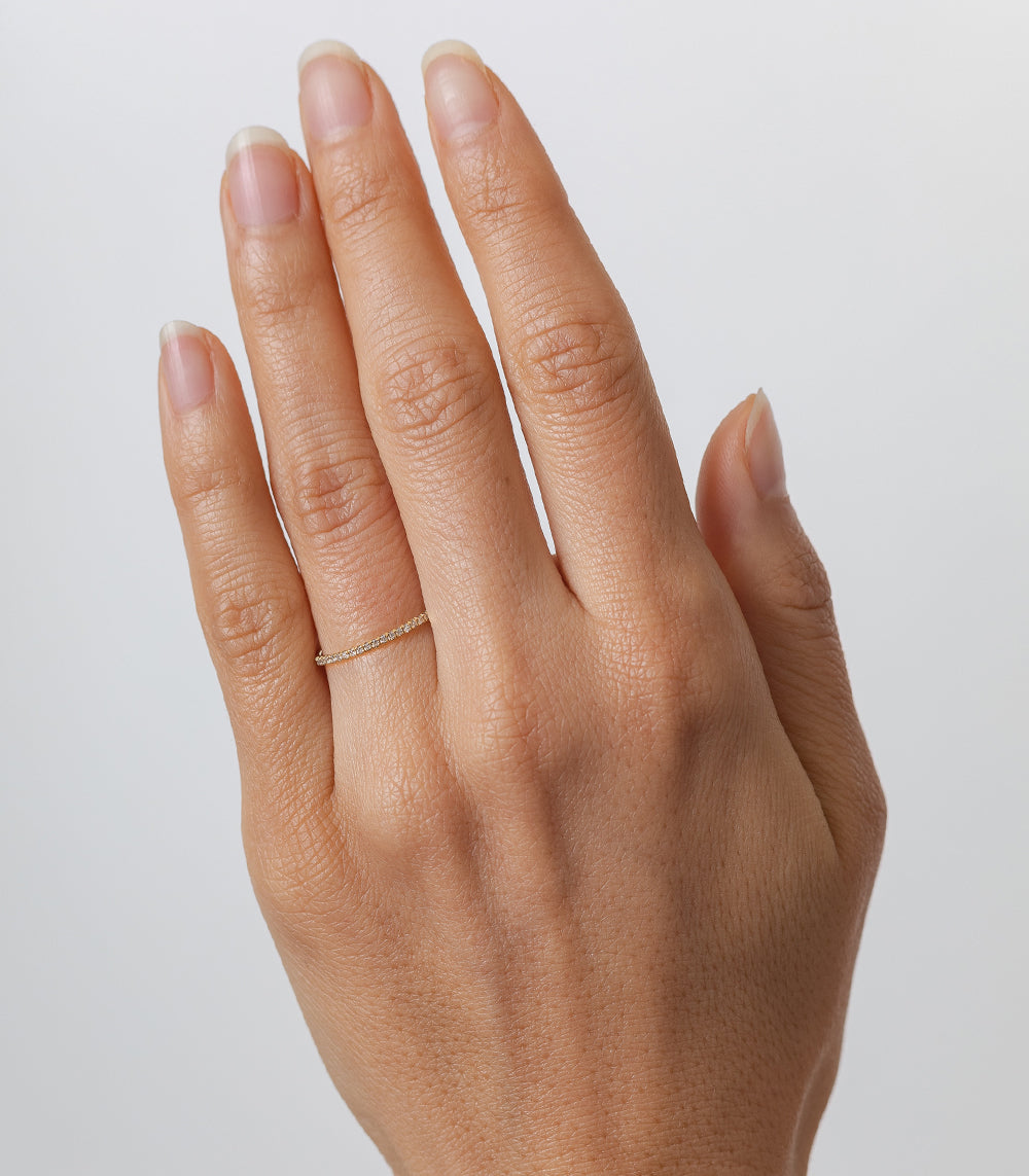 Classic Wire Band by EB-R9, 14K yellow gold wire ring with subtle shiny finish on finger