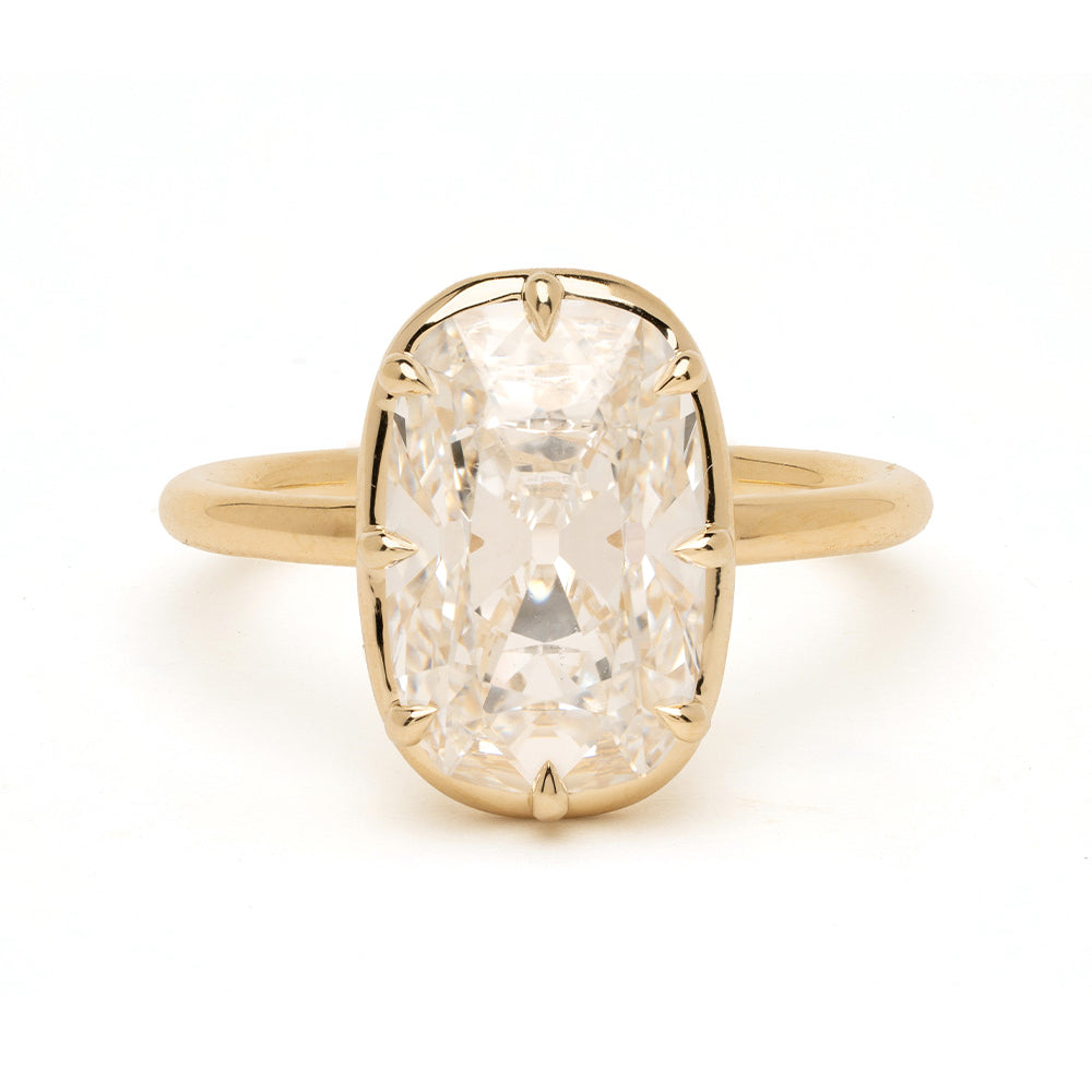 Bibi Sofia Kaman unique engagement ring in understated yellow gold with lab grown diamond cushion setting