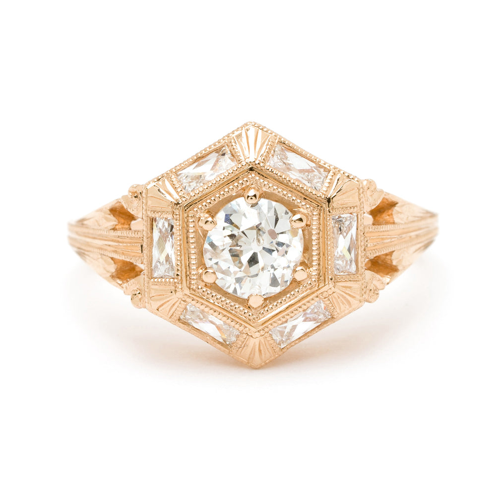 Zelda SK-R54 engagement ring in rose gold with a square halo setting and central round diamond