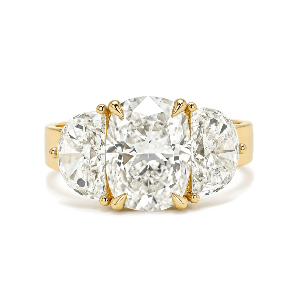 Charlie Sofia Kaman 3 stone engagement ring in warm gold with large center diamond and clear side stones