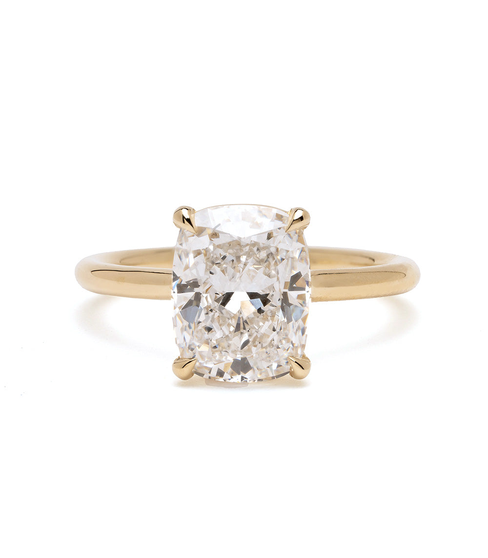 Billie Sofia Kaman engagement ring in gold with cushion-cut diamond center, prong setting
