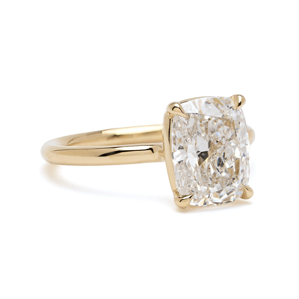 Billie by Sofia Kaman engagement ring in yellow gold with cushion-cut diamond center on a clean white background