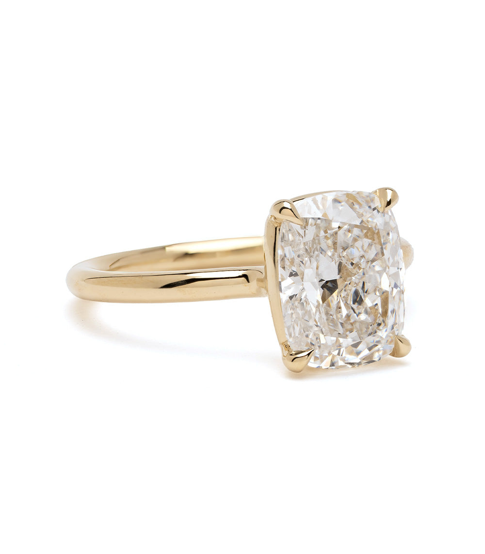 Billie by Sofia Kaman engagement ring in yellow gold with cushion-cut diamond center on a clean white background