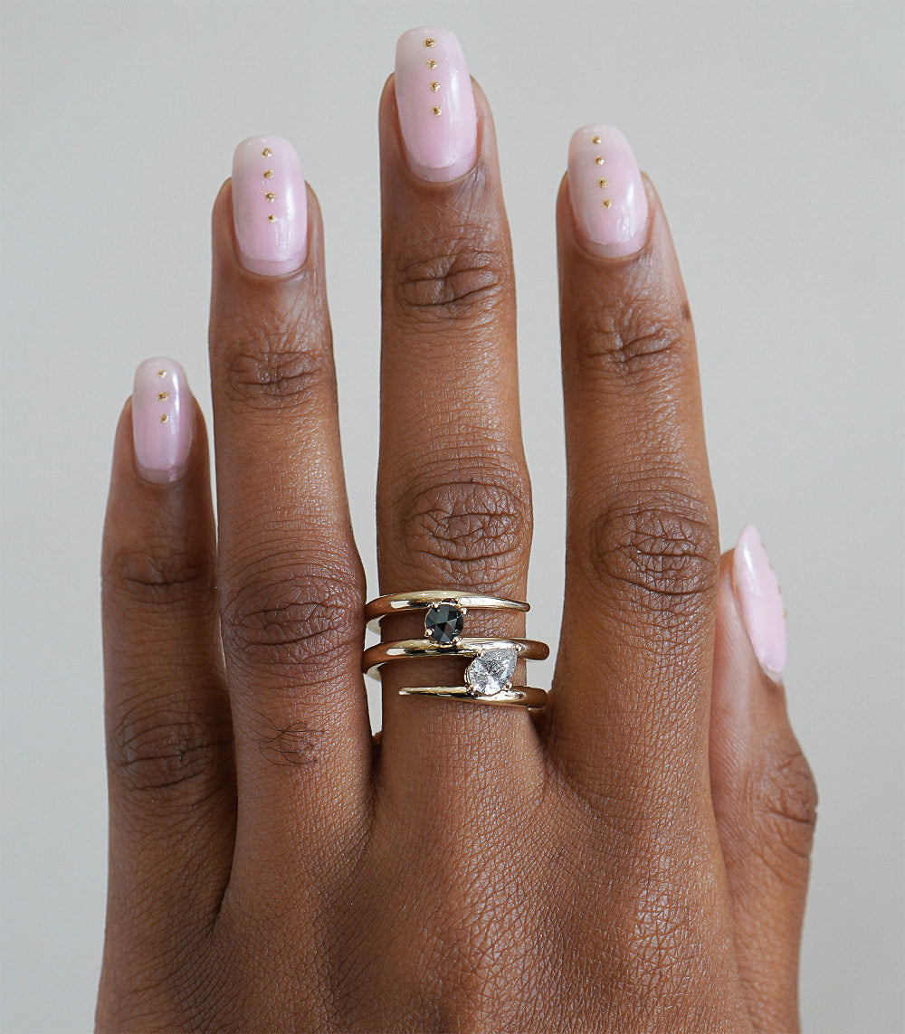 Triple Coiled Band by A-R42 gold band with triple coiled look and clustered stones on finger