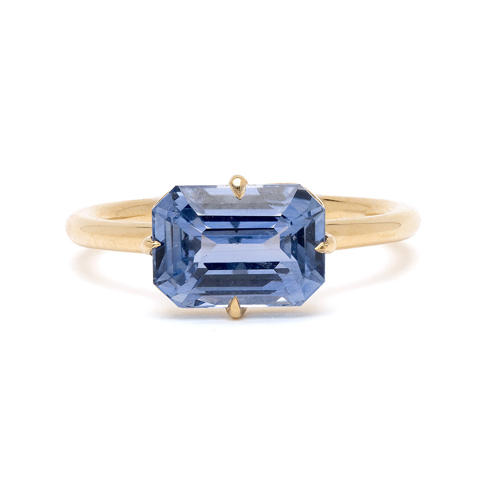 Billie SK-R94-BS-EW-EC-3.00 engagement ring in gold with a rectangular step-cut blue gemstone