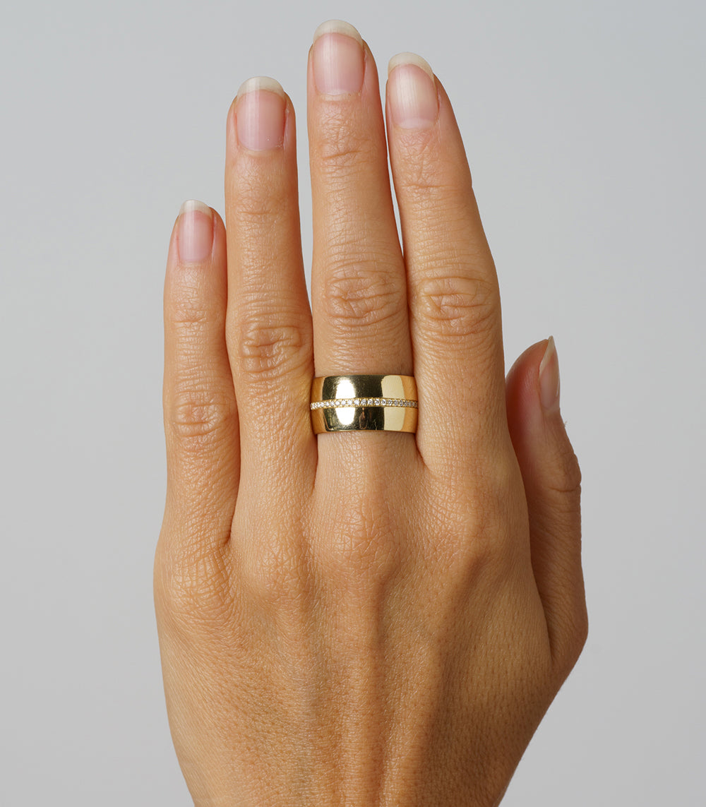 Walk the Line by EGB-R10 14K yellow gold band ring, shiny finish centered on a hand