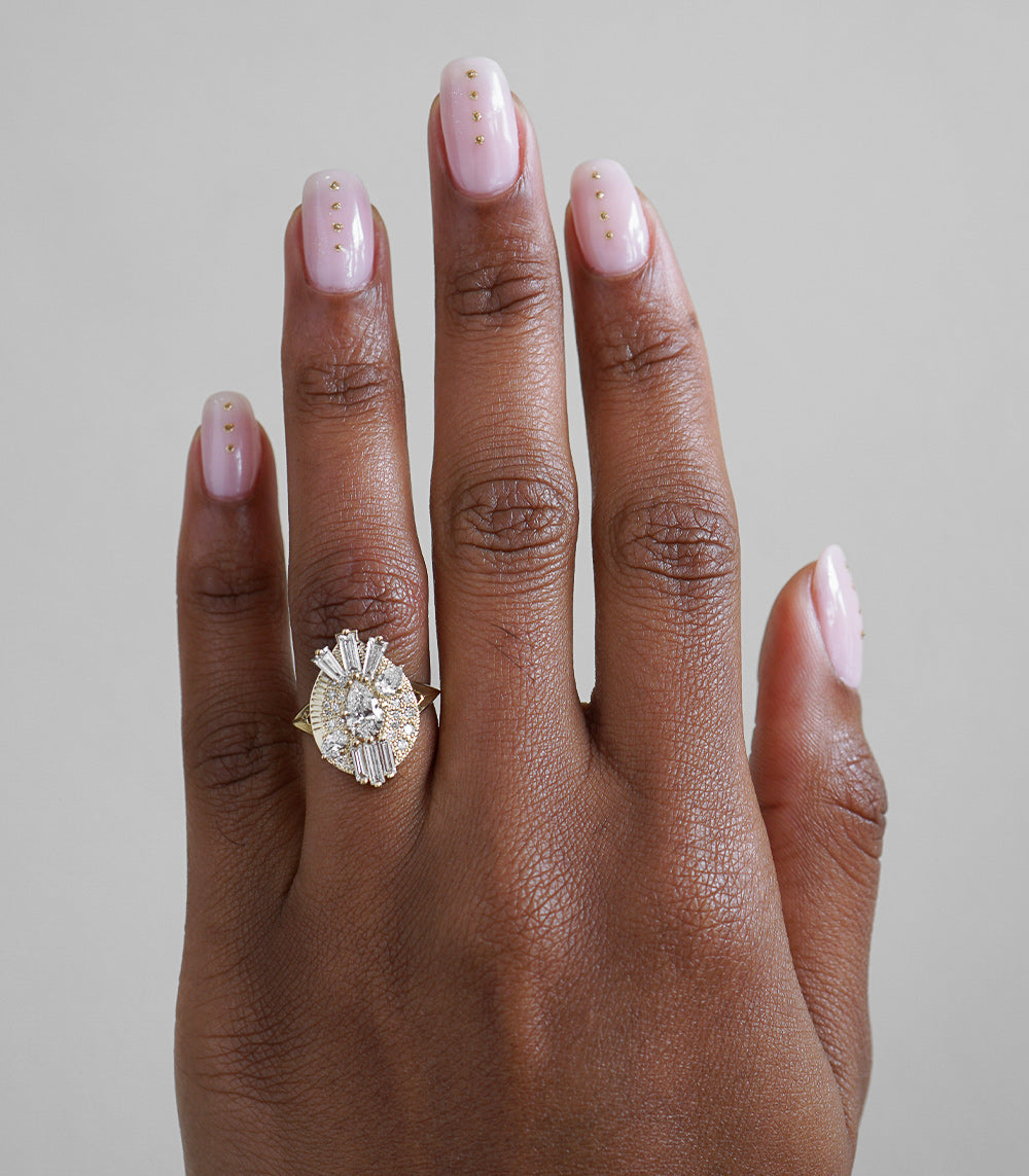 Valentina by MM-R2 engagement ring in yellow gold, halo setting with pavé stones on hand