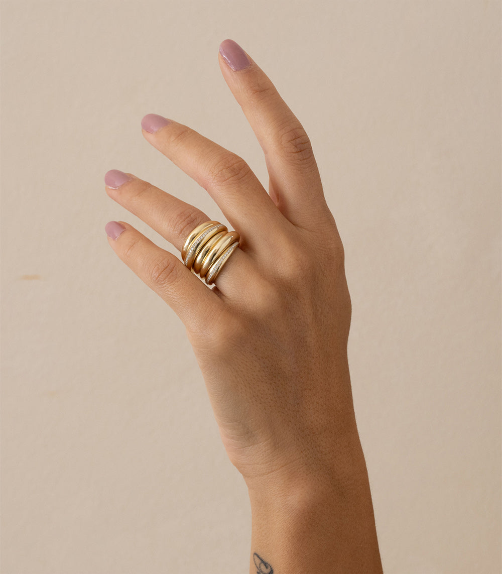 Crescent Band by A-R44 14K yellow gold band with shiny stacked curves shown on a hand