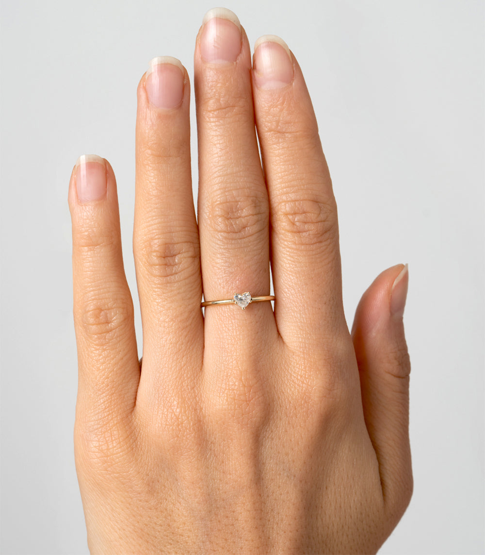Beloved CT-R6 understated engagement ring in yellow gold with a single round diamond.