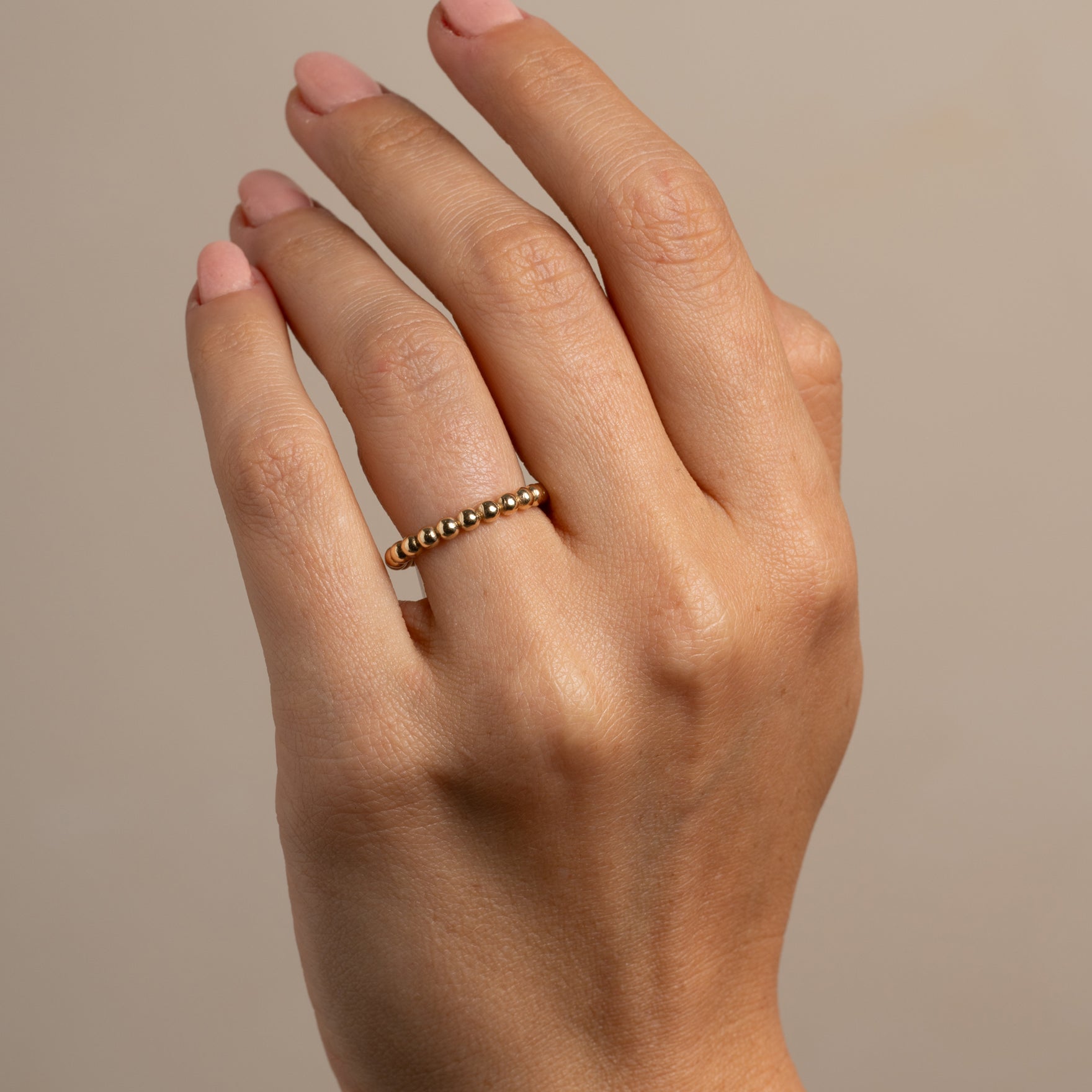 Bold Bubble Band SB-R7 14K yellow gold band with rounded bubble beads on finger close-up
