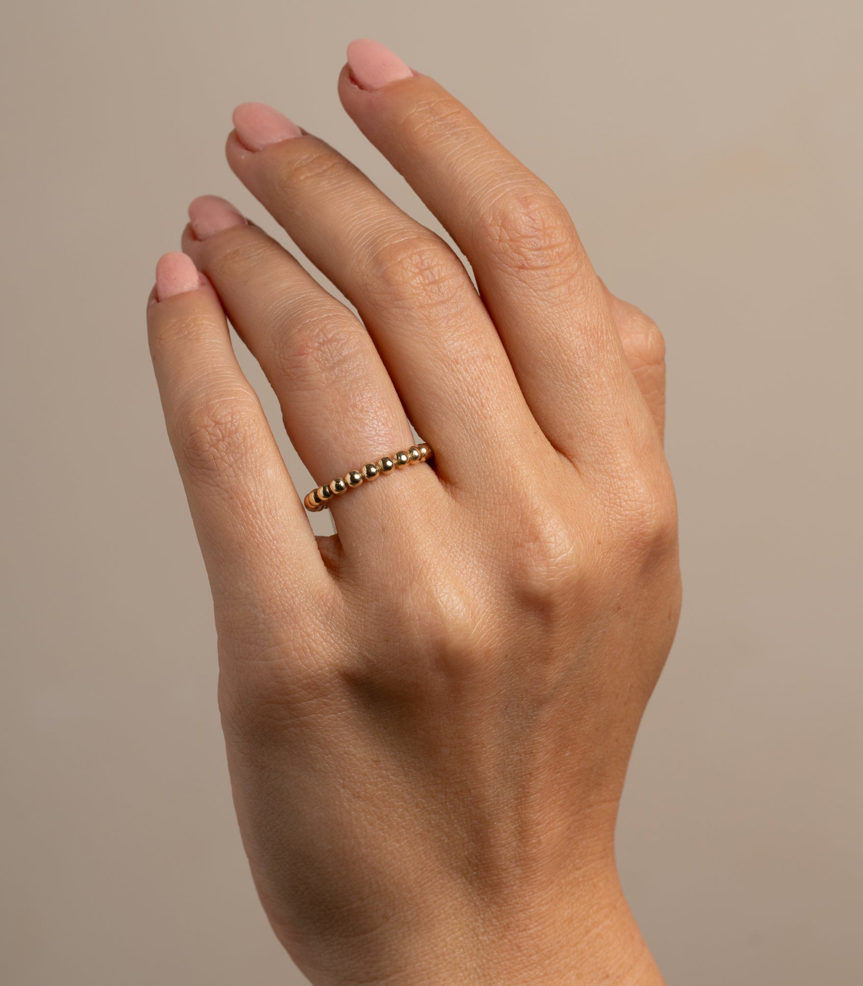 Bold Bubble Band SB-R7 14K yellow gold band with rounded bubble beads on finger close-up