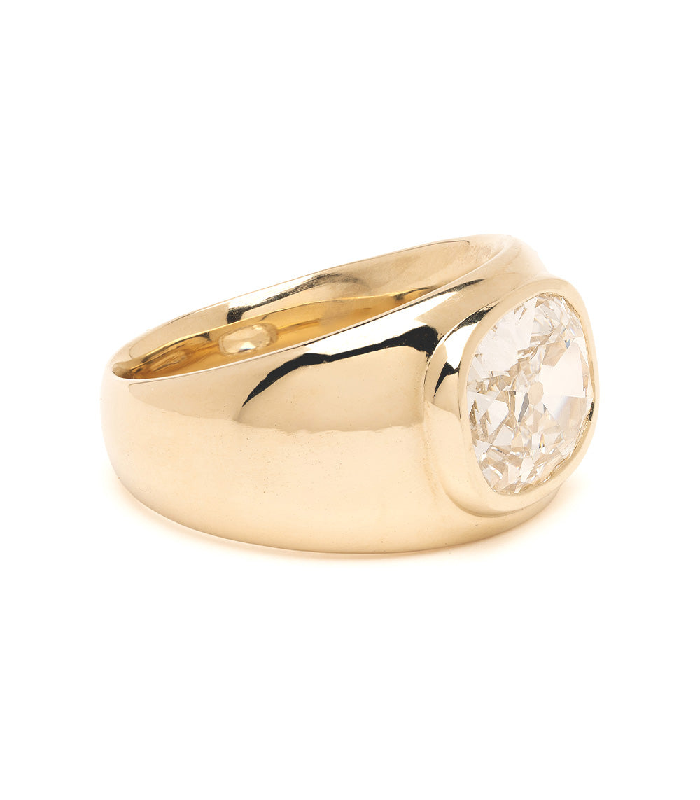 Gold ring with a diamond on a white background
